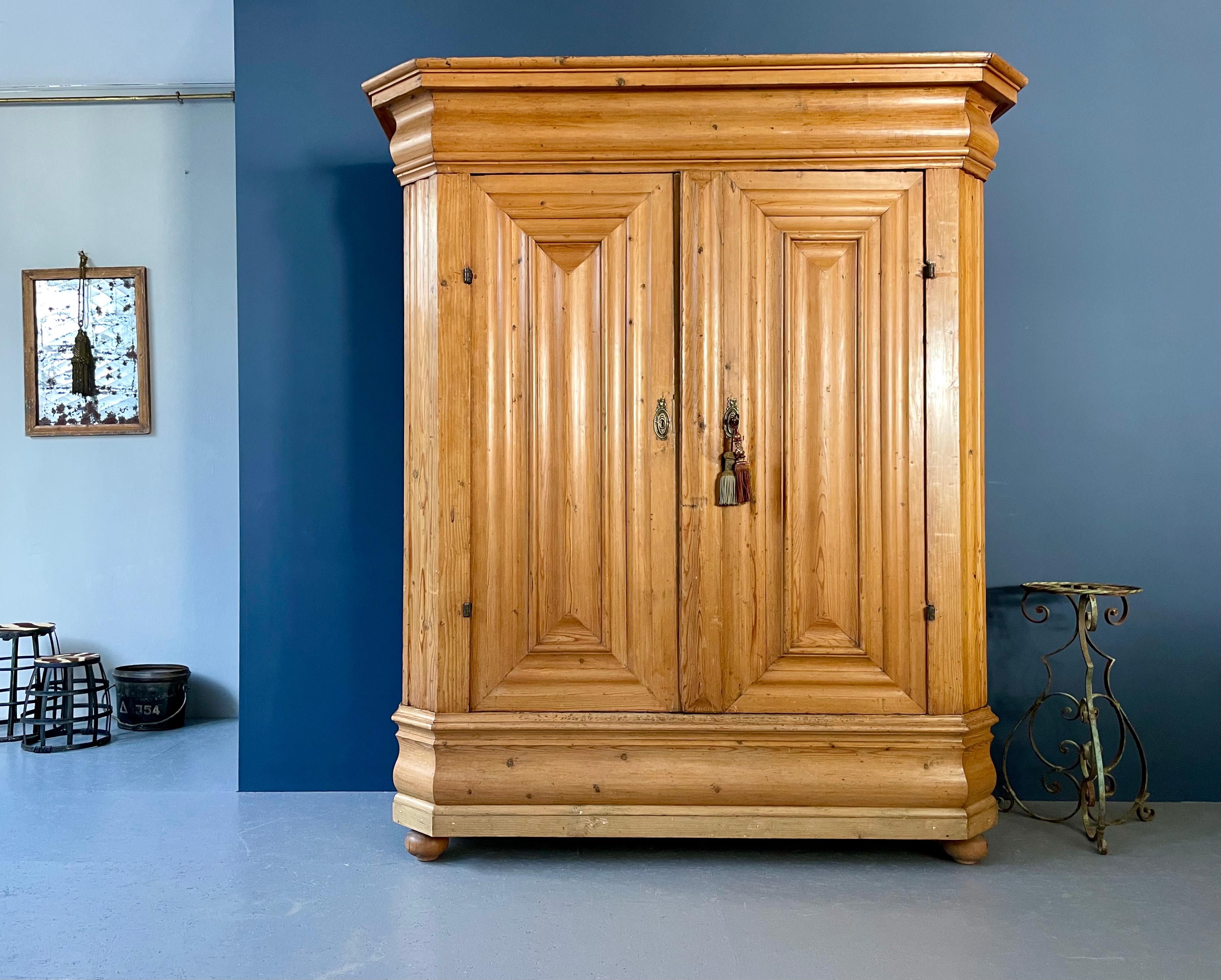 Manufactured in Germany in the 18th Century this pine wood cabinet is sturdy as well as spacious. It still has the original key lock with key as well as the inside partitions. Strong and robust but with charm and style there are some shrinkage