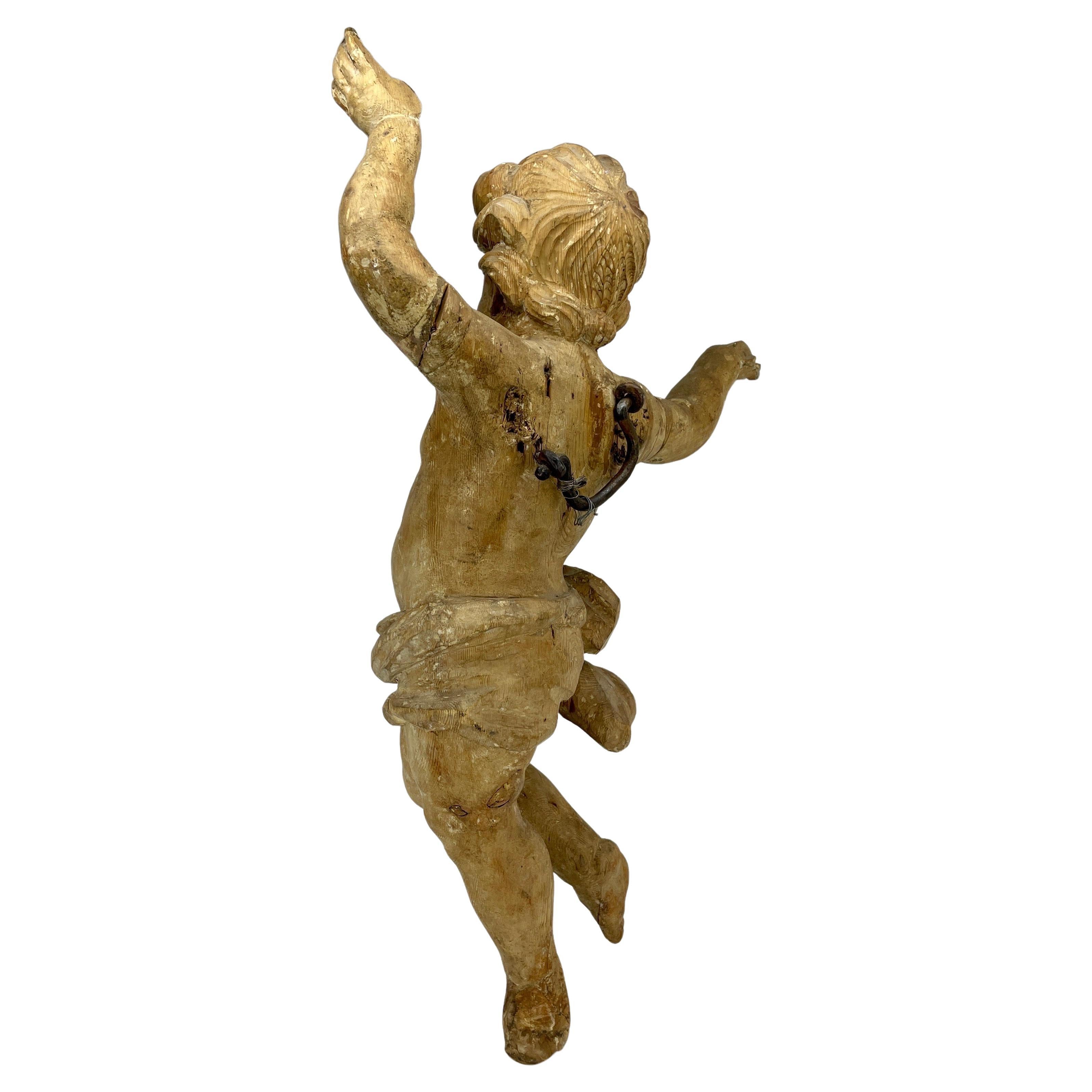 Large Italian Baroque Wall-mounted Sculpture, Hand Carved Oak Angel Putti Figure, circa 1680-1750.
Decorative hand carved cherub with tremendous character and charm having kept its original patina. Intricate details in the angel’s hair, hands and