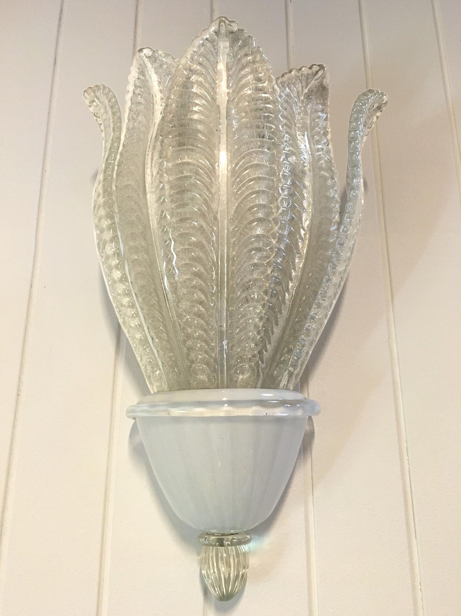 A large glass leaf sconce by Barovier, with original labels. (Priced Per Item)

Italian, Circa 1960's

Five (5) Scones Are Available and Two (2) Chandeliers.

Each Sconce: $6,500.00