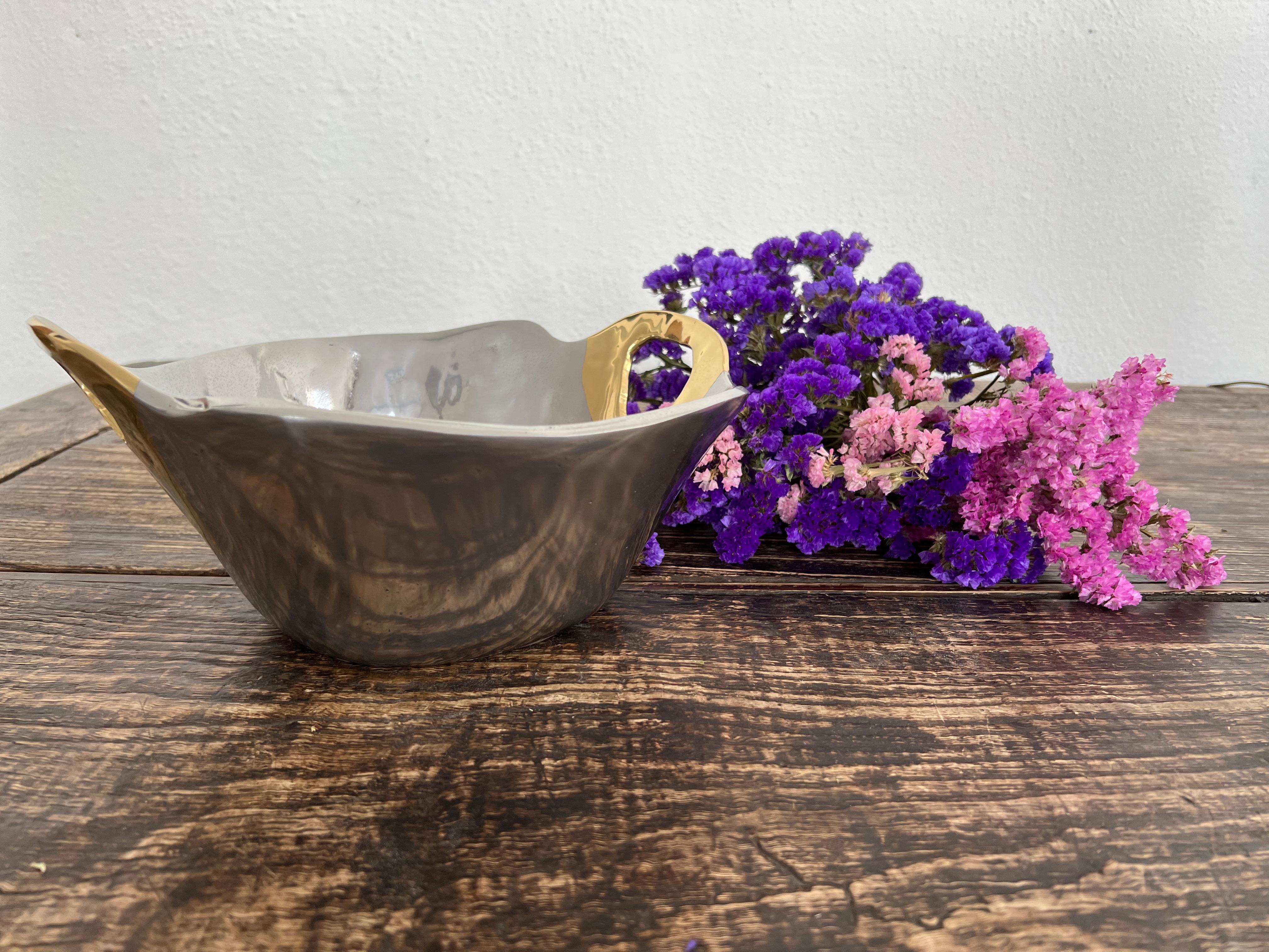 The decorative Basket Bowl was created by David Marshall, it is made of sand cast aluminum and sand cast brass.
Handmade, mounted and finished in our foundry and workshop in Spain from recycled materials.
Certified authentic by the Artist David