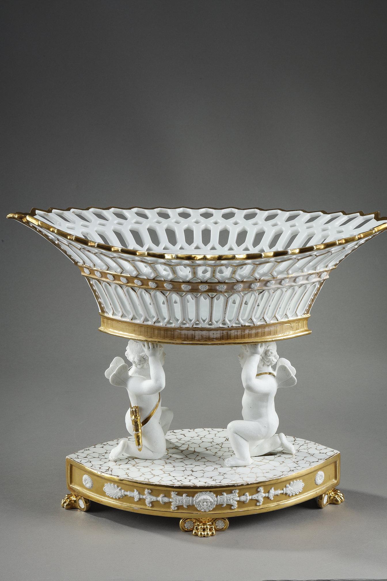 French Large Basket in Paris Porcelain resting on two cupids For Sale