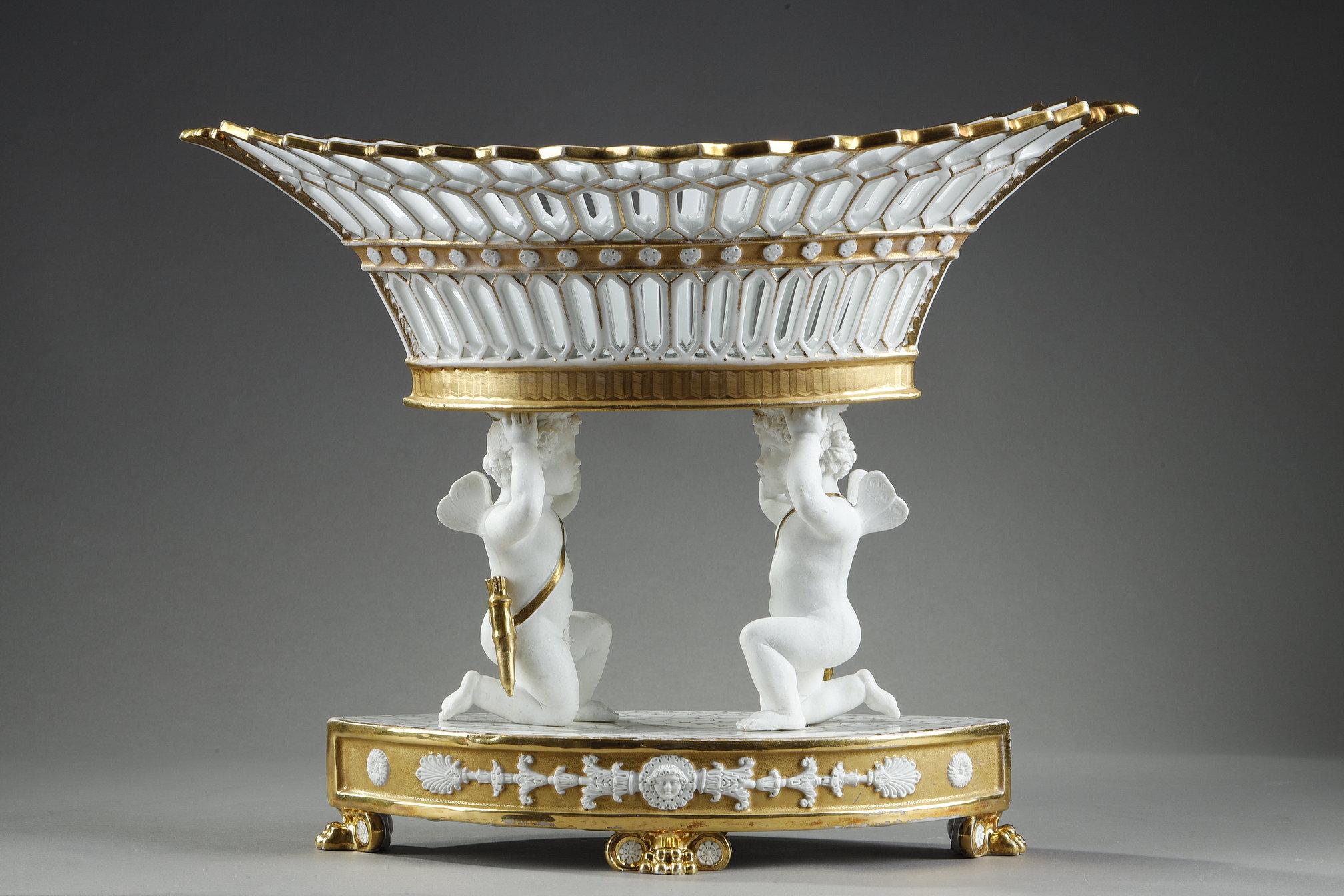 Mid-19th Century Large Basket in Paris Porcelain resting on two cupids For Sale