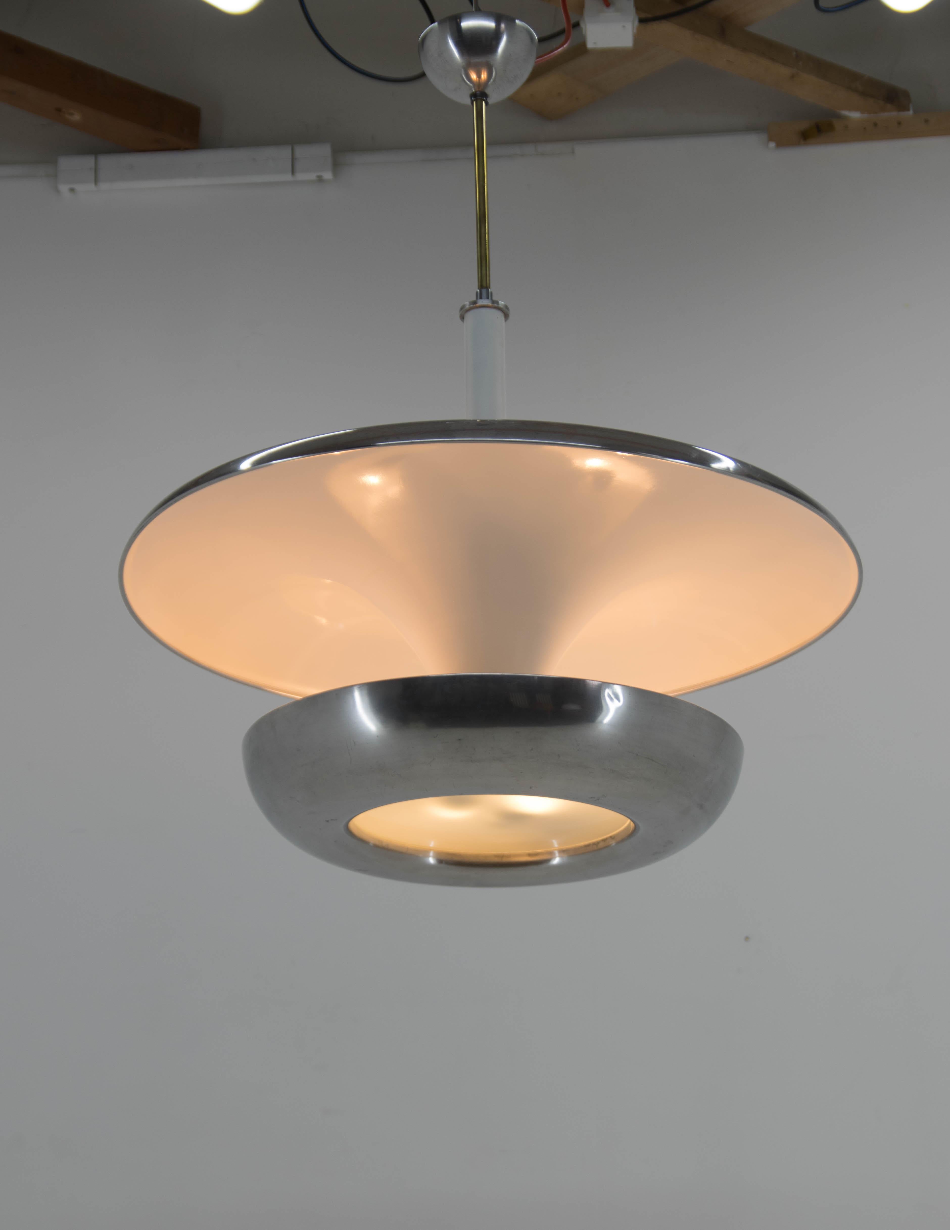 Ultra rare XXL Bauhaus chandelier made by IAS company. The biggest version of its kind from 1920s. Very eye-catching piece!
Item was carefully restored. The shade made of aluminum was polished. Original sand blasted glass on bottom. New white paint.