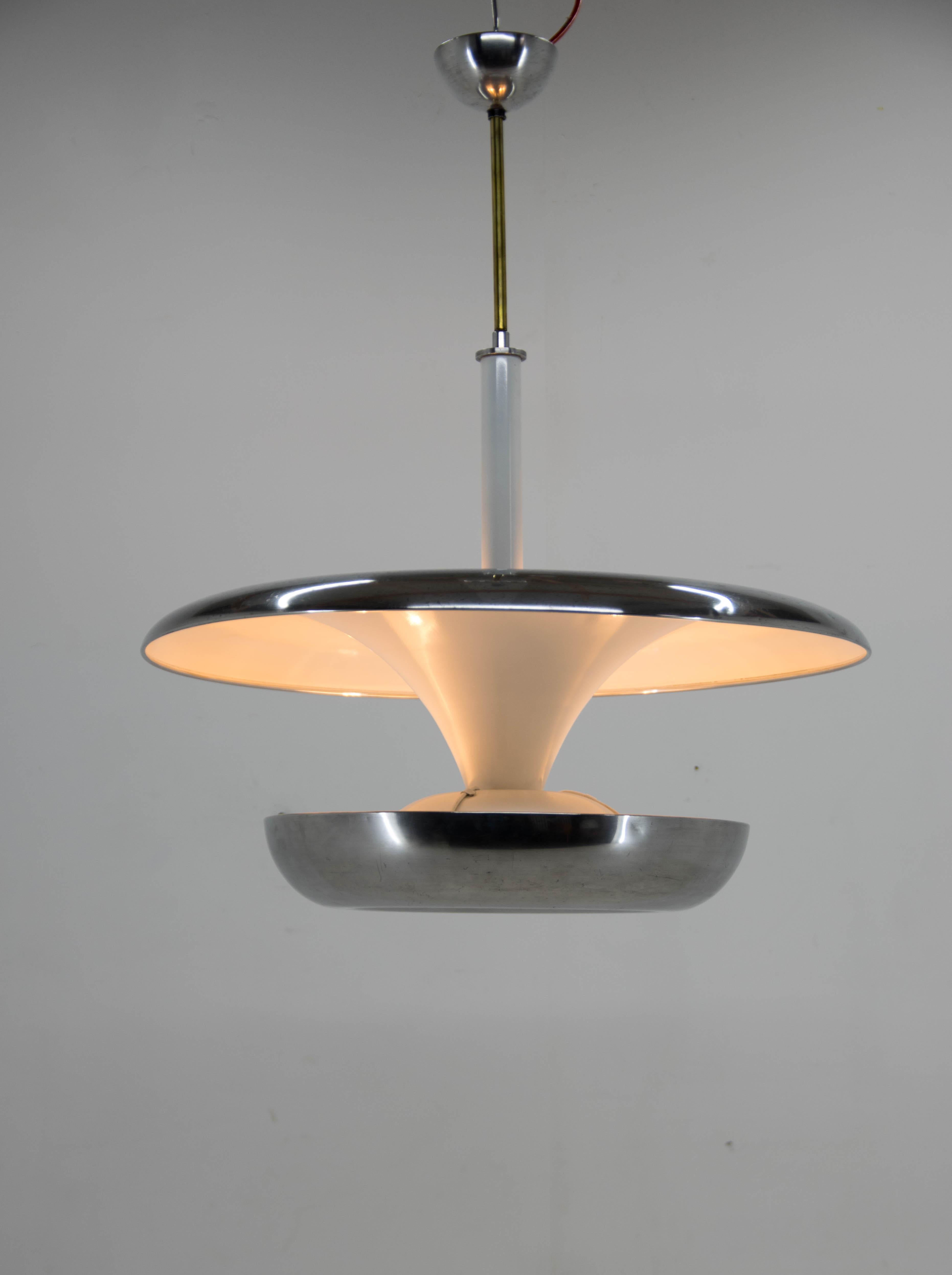 Ultra rare XXL Bauhaus chandelier made by IAS company. The biggest version of its kind from 1920s. Very eye-catching piece!
Item was carefully restored. The shade made of aluminum was polished. Original sand blasted glass on bottom. New white paint.