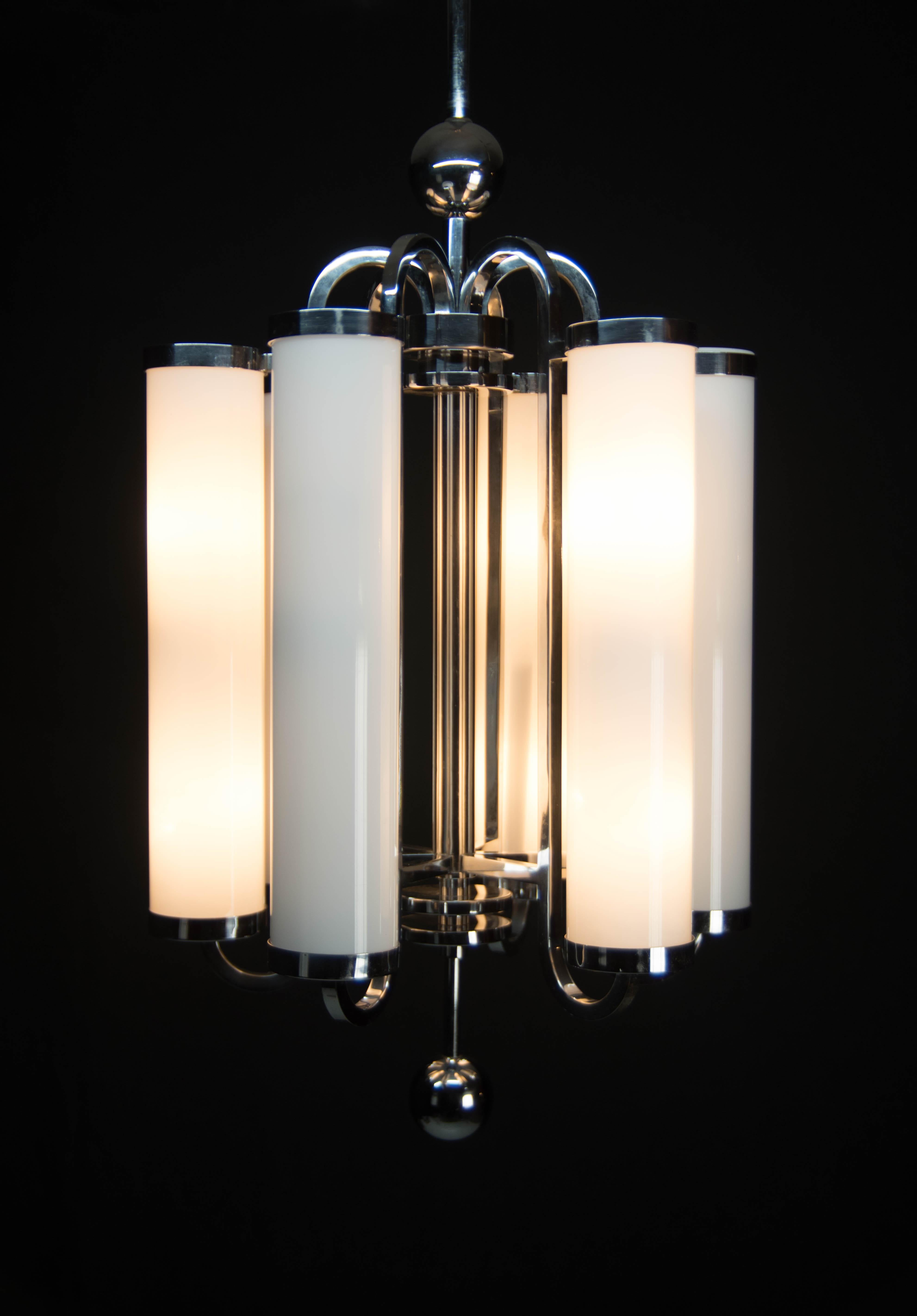 Unique beautiful huge Bauhaus chandelier with two separate circuits - 6+6 40W bulbs.
Chrome-plating with age patina in a good condition - polished
Glass shade measures: height 40cm, diameter 8cm
Rod could be shortened on demand
Rewired - US