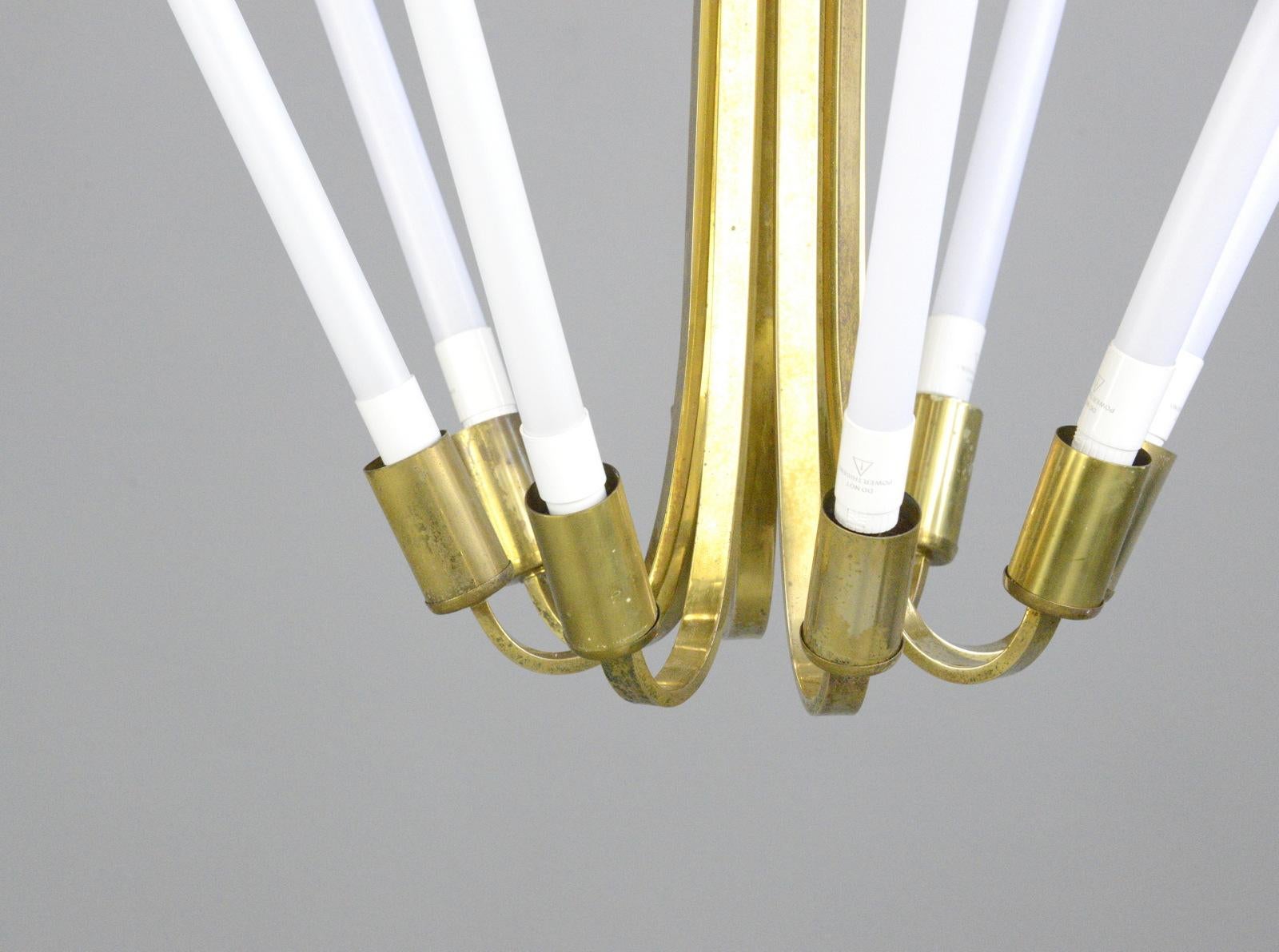 Large Bauhaus lobby chandelier, circa 1930s

- Sculptural curved brass
- Takes 8x LED tube bulbs
- Original designed to hang in cinema lobbies
- Made by Kaiser
- German, 1930s
- Measures: 70cm tall x 98cm wide

Condition report:

Fully re