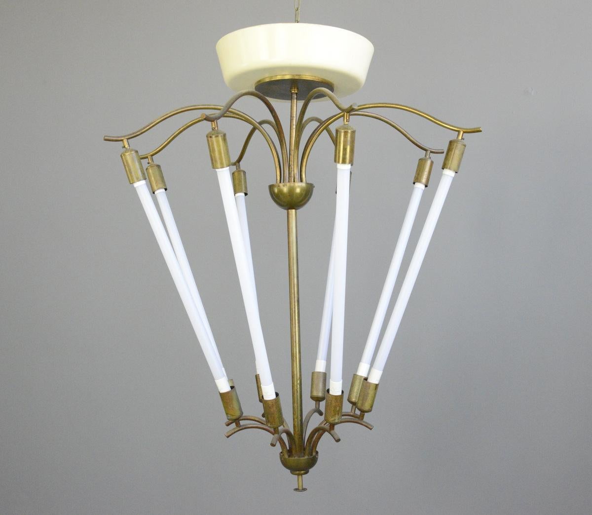 Large Bauhaus lobby chandelier, circa 1930s

- Sculptural curved brass
- Takes 8x LED tube bulbs
- Original designed to hang in cinema lobbies
- Made by Kaiser
- German, 1930s
- Measures: 112cm tall x 93cm wide 

Condition report:

Fully