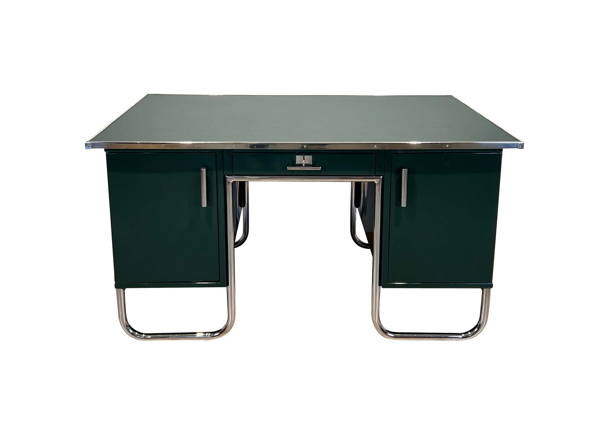 Large Bauhaus “Partners desk” (usable from two sides) from Germany around 1930
High gloss lacquered in the original green color (British Racing Green).
Polished steel tube and partly newly nickel-plated. Each side with 2 doors and 1 drawer.
Old