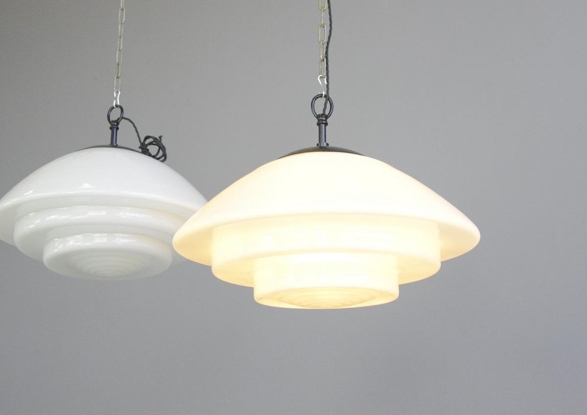 Large Bauhaus pendant lights by Mithras circa 1930s

- Price is per light (8 available)
- Stepped opaline glass
- Comes with 100cm of black braided cable
- Comes with ceiling rose and chain
- Takes E27 fitting bulbs
- Produced by August