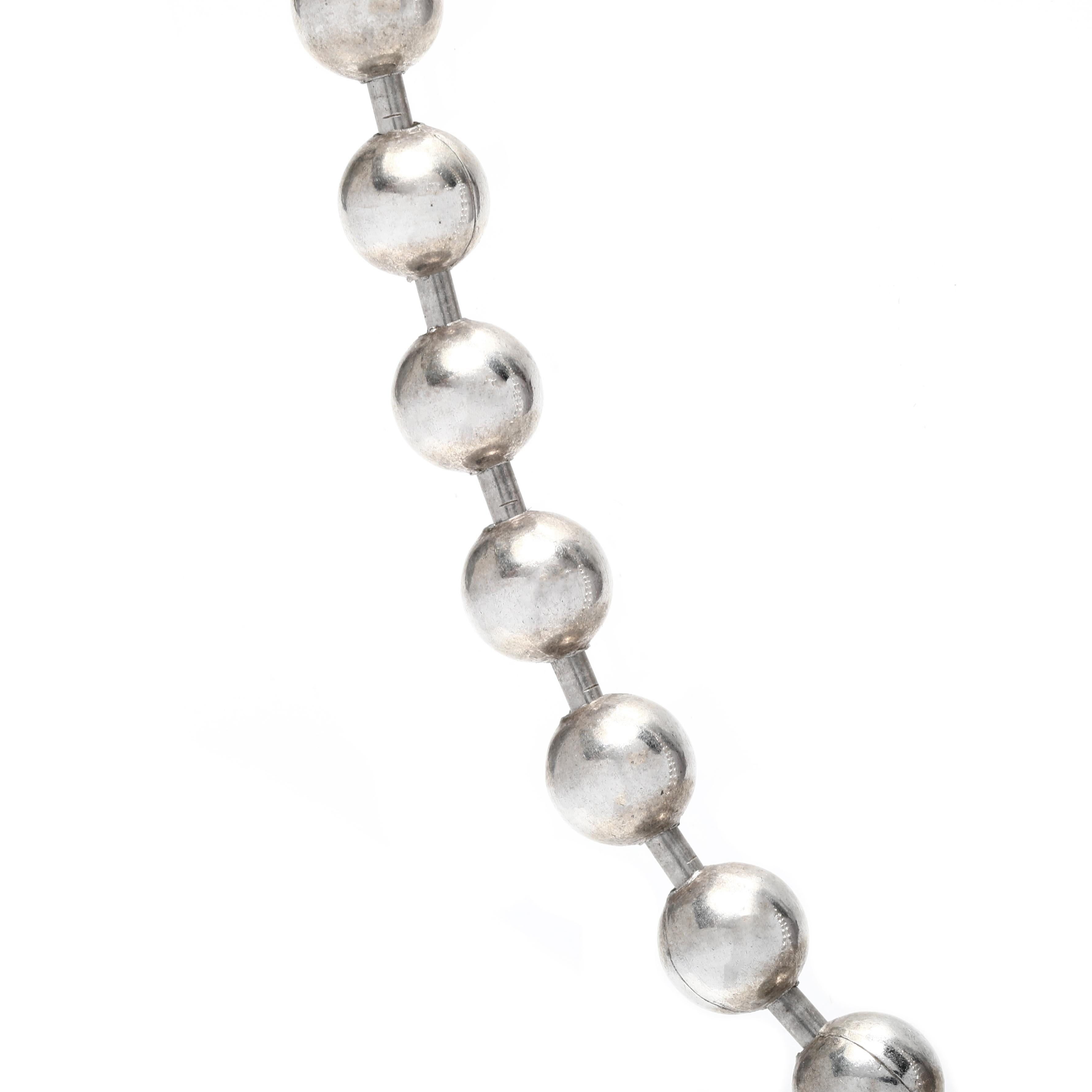 This large sterling silver bead chain necklace is the perfect addition to any outfit. The length of the bead chain is 18.50 inches and is crafted with genuine sterling silver for a stunning and eye-catching look. Whether you're looking for a