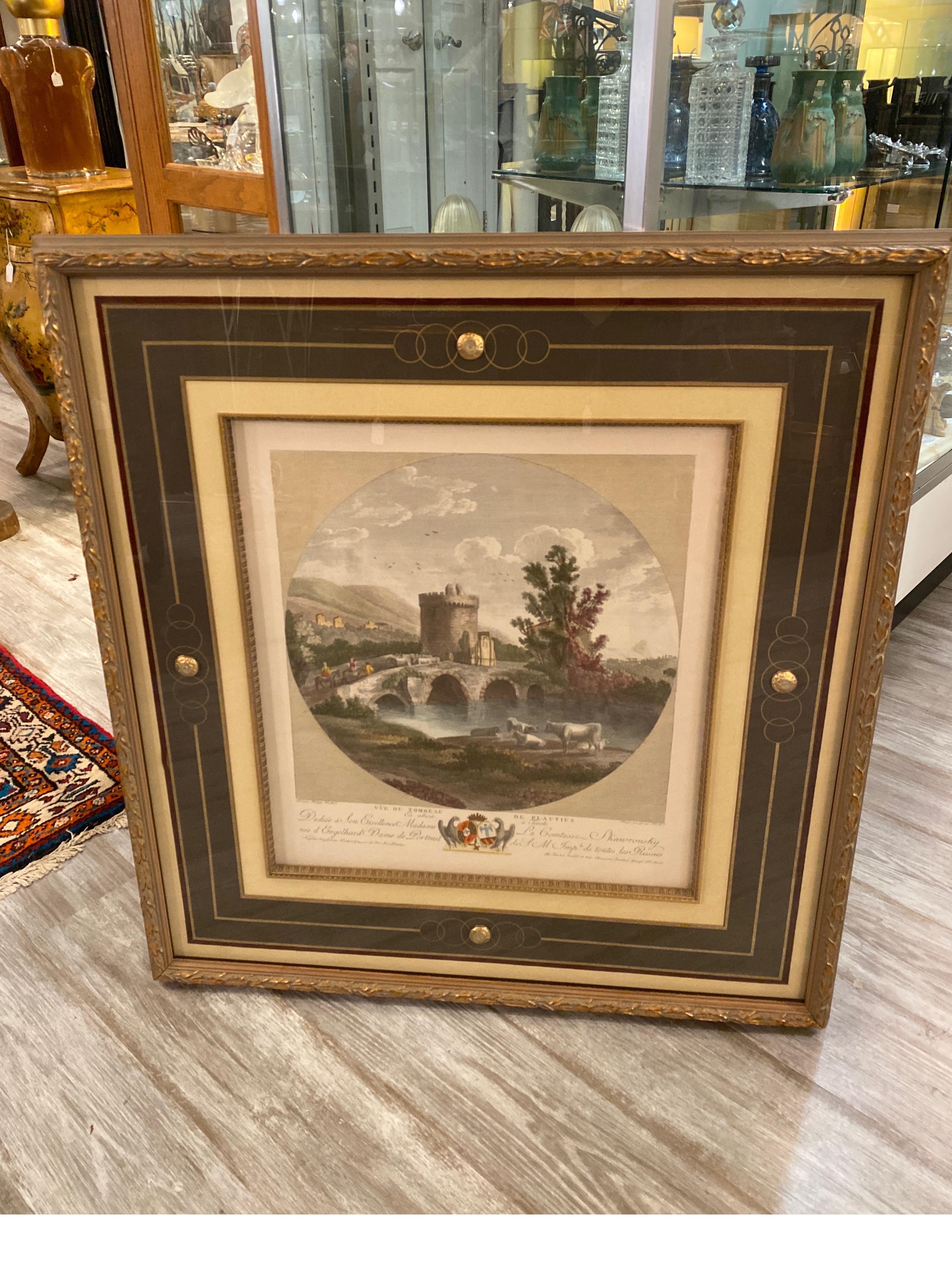 A colored lithograph of the Famous painting Vue de trom beau de Platius from the 18th Century. The original by Hackert Phillip. The beautiful from with elaborate hand decorated mat with medallions on the four sides mounted on the matt. The highly