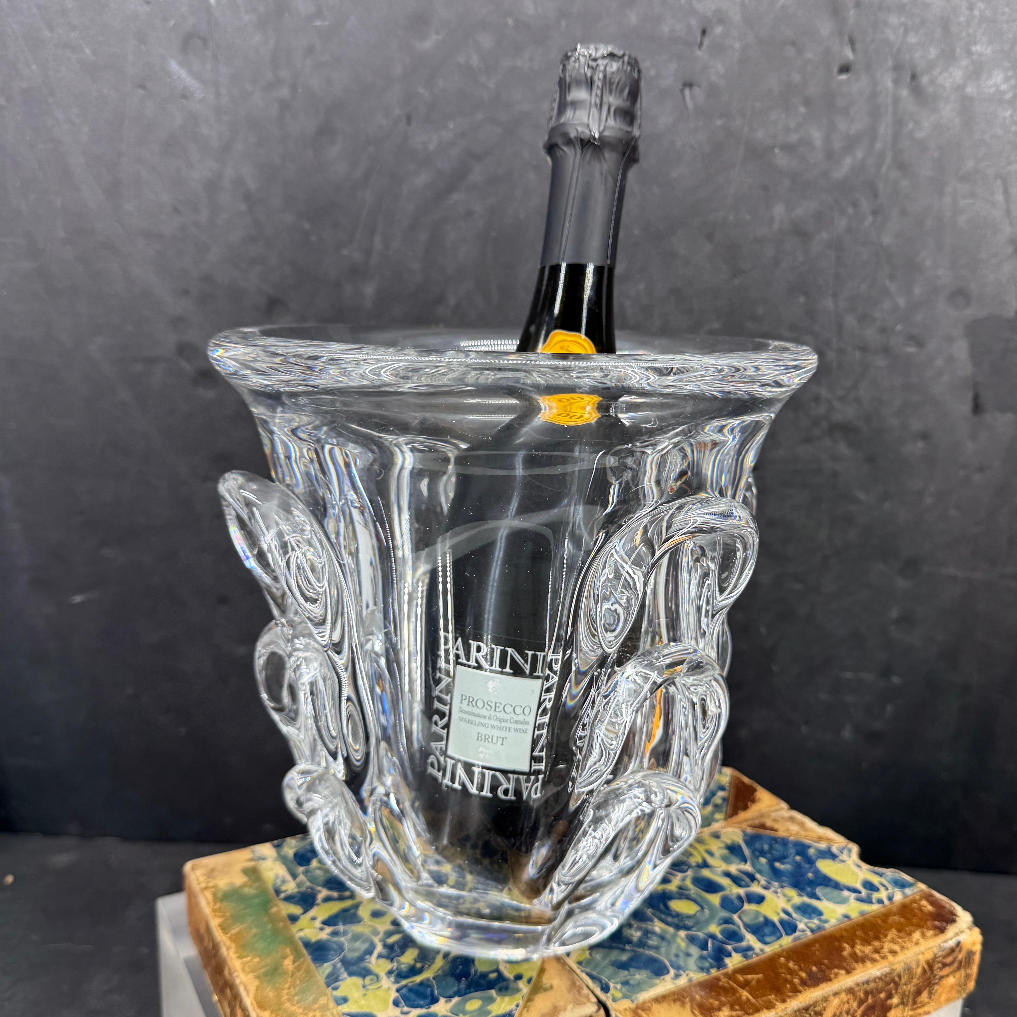 Impressive and substantial thick crystal vase with many uses. Would make a wonderful addition to any home as a centerpiece filled with fresh flowers, filled with ice as a wine chiller or standing alone on a buffet or table. This piece is signed Van