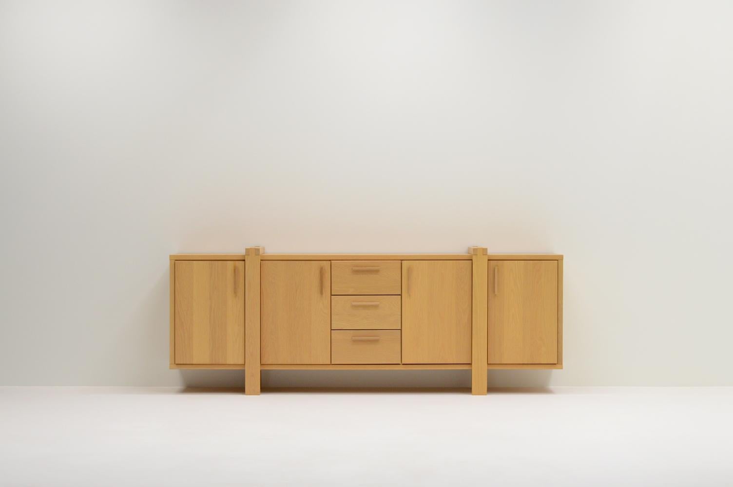 Large Belgium oak sideboard. Mostly made of solid oak. 3 drawers and 4 doors. Behind every door are modular shelfs. In very good vintage condition.

Request a quote for the latest shipping rates.