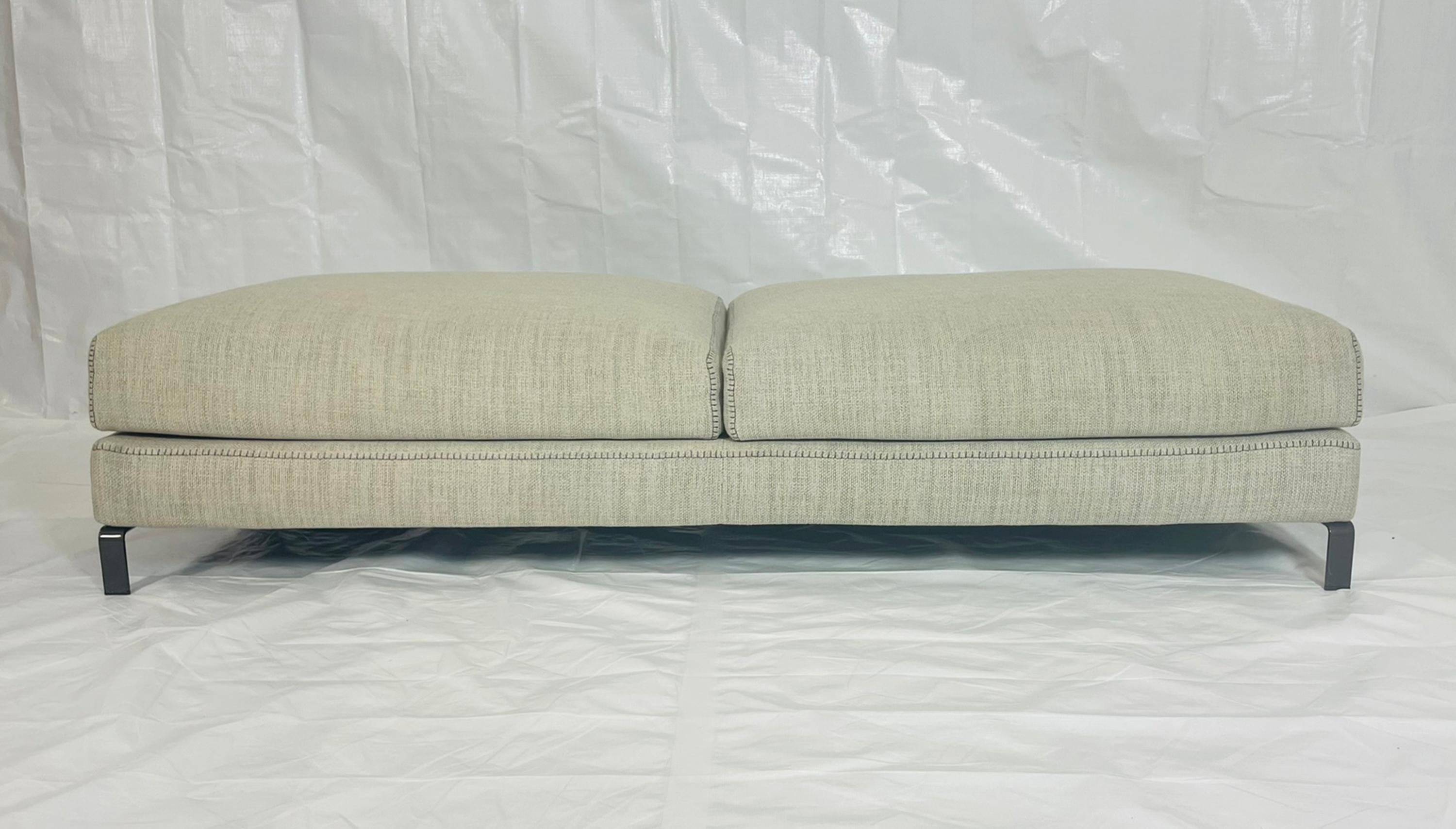 Elegant and versatile large bench designed by Antonio Citterio for B&B Italia, made in Italy. A superb example of refined Italian craftsmanship, this piece reflects Citterio’s signature balance between minimal form, structural integrity, and