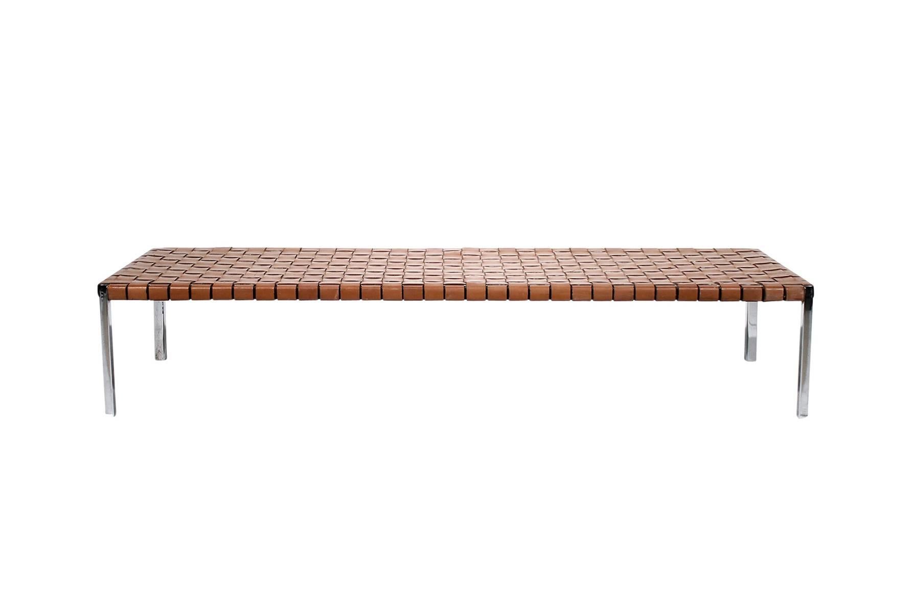 Large bench or daybed designed by Estelle and Erwine Laverne for the American company Laverne International. Chrome legs and steel supports with woven brown belting leather seats.