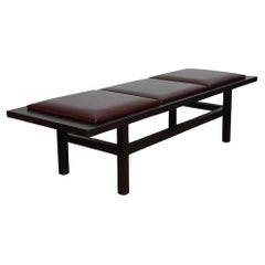 Large bench in black wood and leather, 20th century work