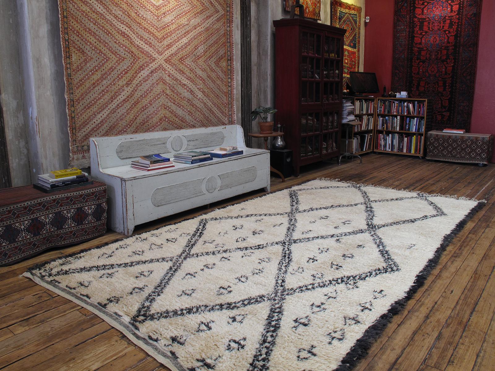 A great old example of Moroccan Berber weaving, attributed to the Beni Ouarain tribes of the Middle Atlas. The Classic diamond grid pattern is enlivened here with unique details that are reminiscent of enigmatic rock carvings. The wool quality and