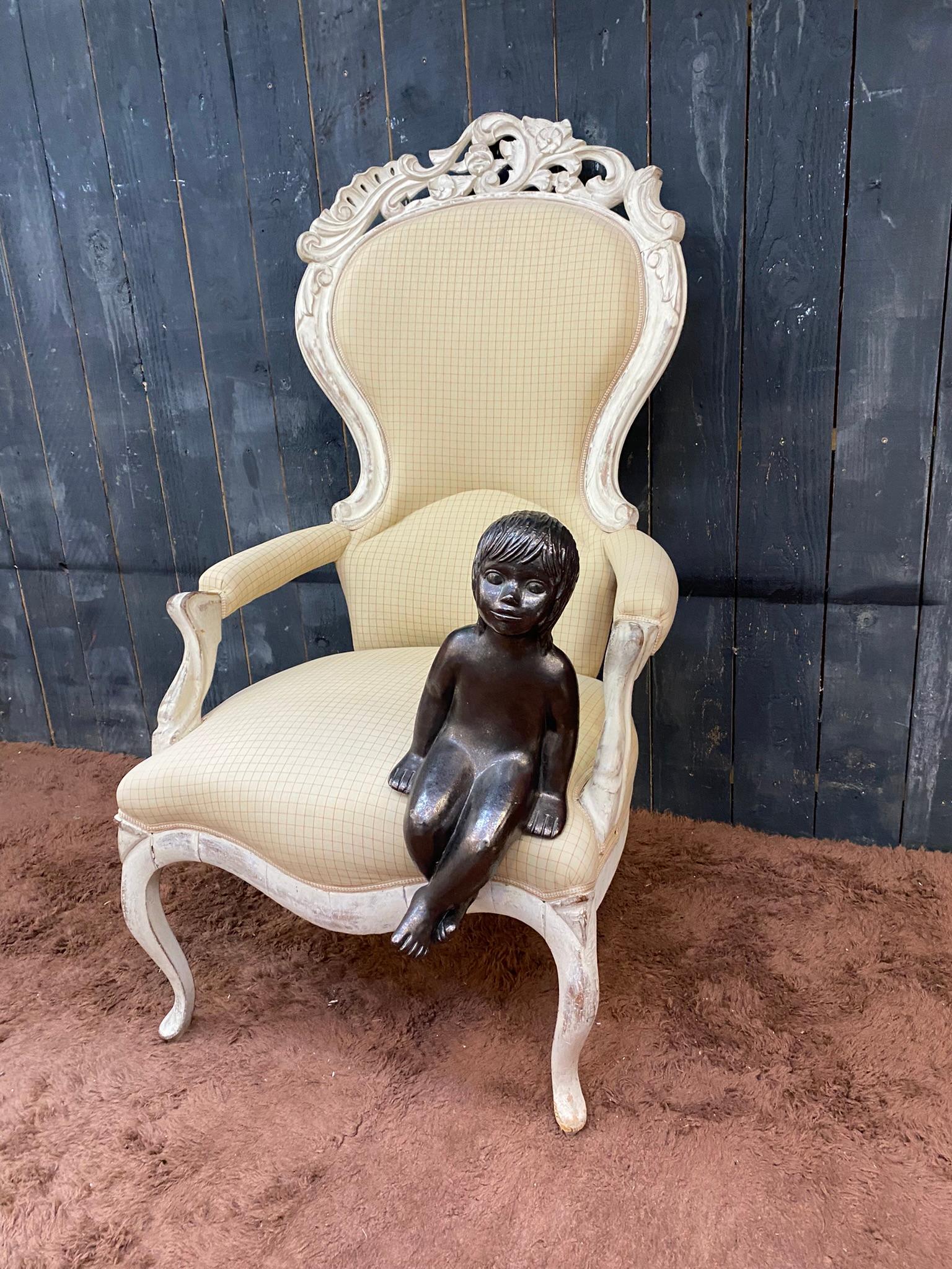 Large bergere armchair in Louis XV style, in painted wood, circa 1930.