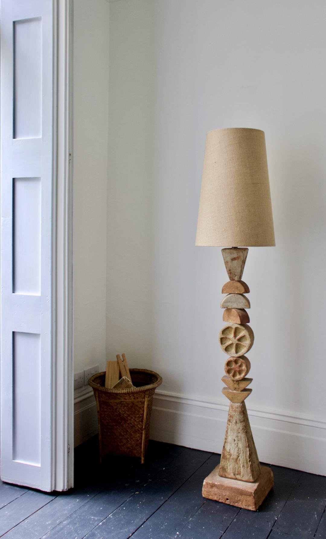 A monumental ceramic TOTEM floor lamps by Bernard Rooke, mid-20th century England.

Beautiful sculptural piece of studio pottery, made up of ceramic elements in natural tones of terracotta and stone. The round elements are decorated on one side with