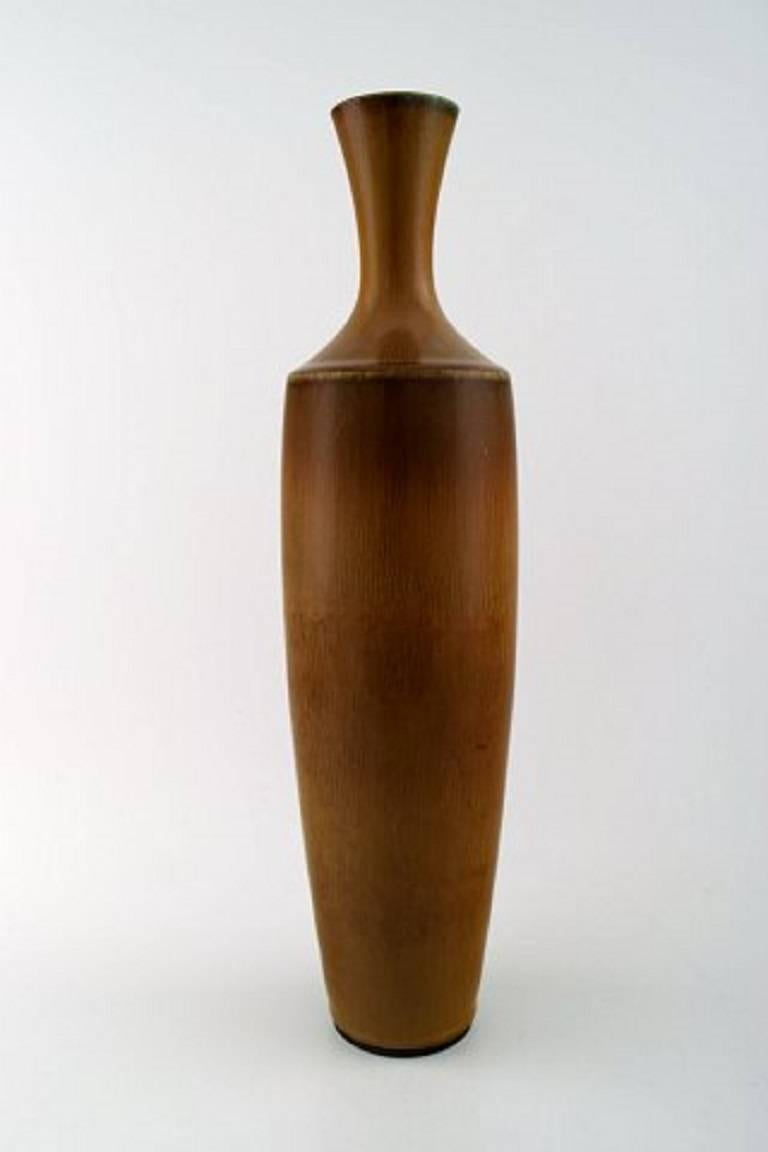Large Berndt Friberg Studio art pottery vase. Modern Swedish, mid-20 century. Unique, handmade. Amazing glaze in shades of brown!
Perfect. 1st. factory quality.
Measures: 35.5 x 9 cm.