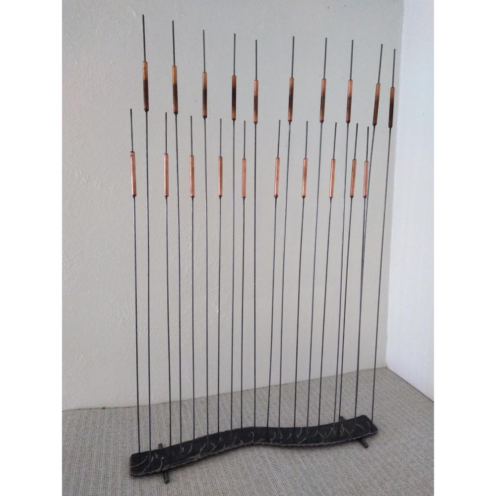 20 copper cat-tail rods adhered and mounted on metal. 

Measures: 27