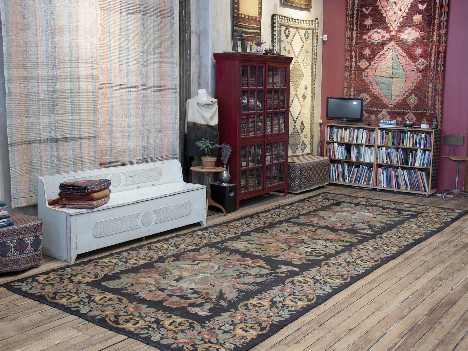 The historical region of Bessarabia in Eastern Europe, in present day Moldova and Ukraine, is famous with its kilims adorned with realistically drawn floral designs. This Kilim is a great example of that tradition, with beautifully articulated