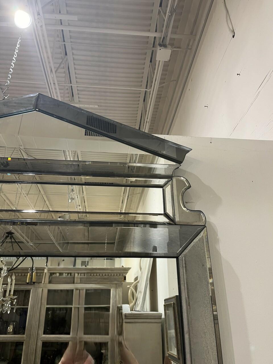 Elegance meets grandeur in this Large Beveled Neoclassical Mirror, reminiscent of the Dennis and Leen style. Crafted with meticulous attention to detail, its beveled edges enhance the sense of depth and sophistication. The mirror's generous