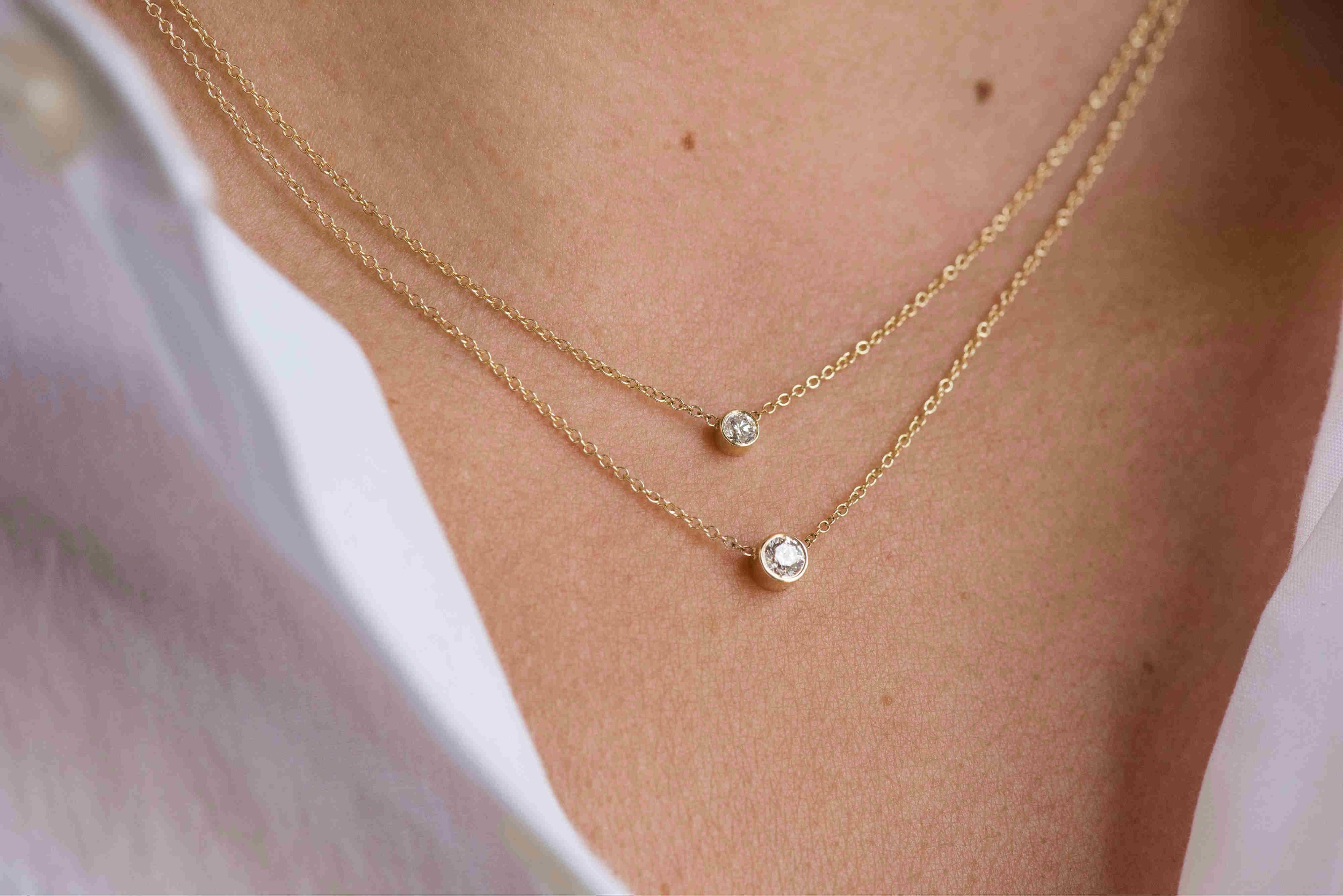 Beautifully handcrafted round cut 0.25ct. bezel diamond, hanging from a 14k solid gold dainty cable link chain.

Made in L.A.
14k Yellow Gold
16