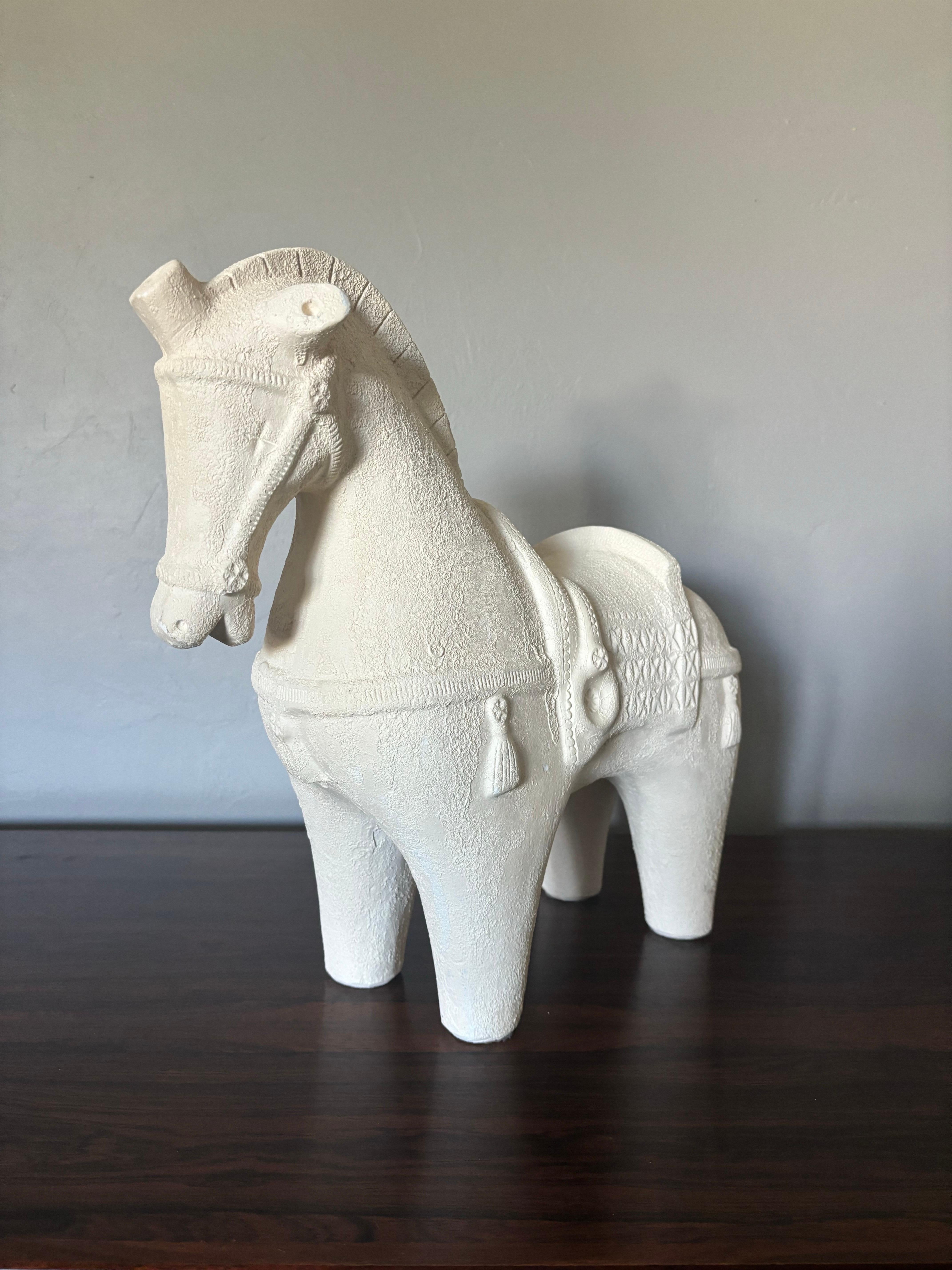 Beautiful example of the classic Bitossi horse. One of the larger examples at 16” long. In a beautiful, rare, neutral off white texture glaze. Numbered on the belly of the horse. Minor chipping in glaze. 

16” long
15.5” tall
7” deep