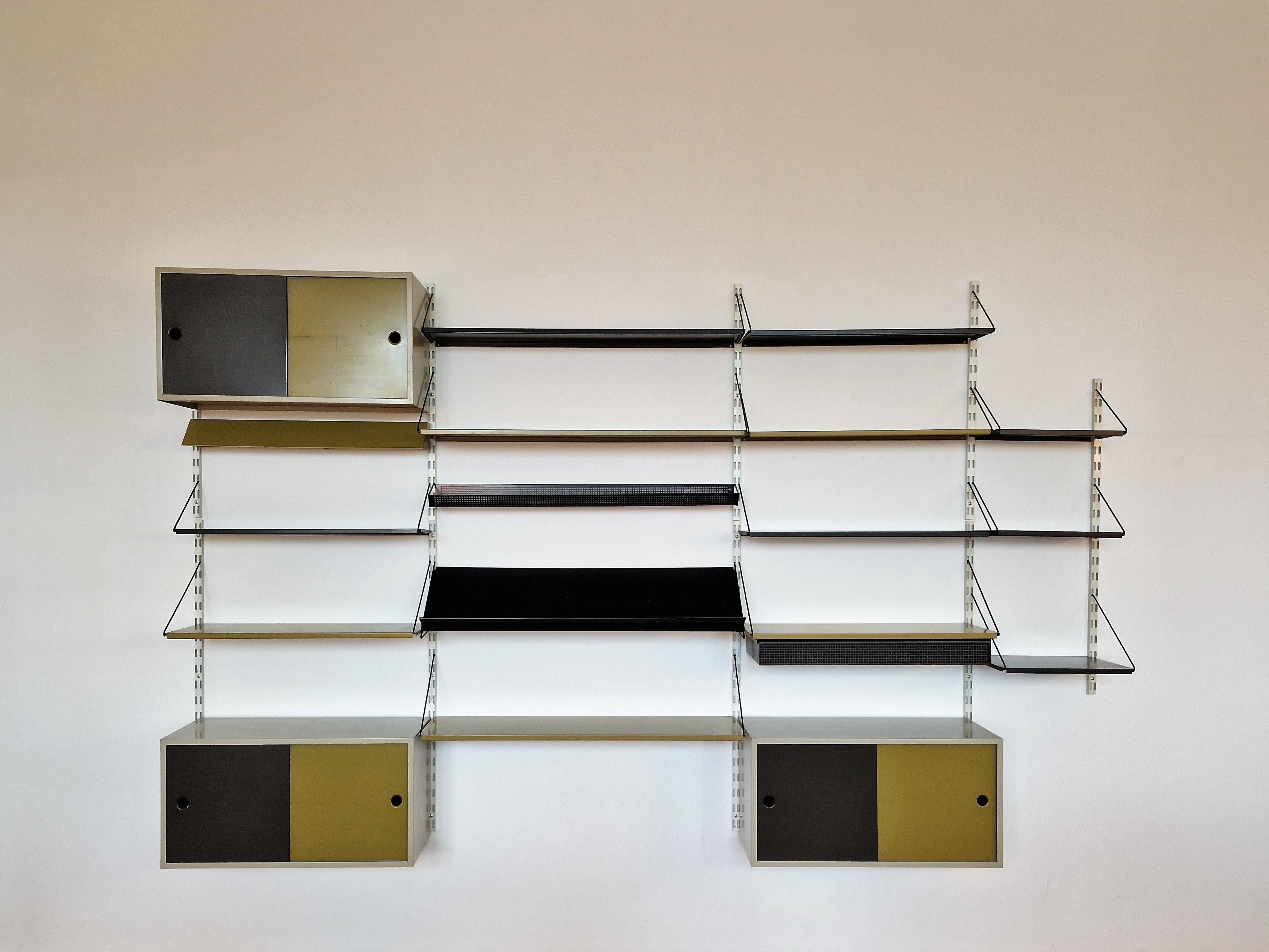 This is a great composition of different elements in a Pilastro wall unit. A diverse collection of different parts selected to make a complete unit of the famous design by Tjerk Reijenga. The set consists out of white wall mounts with shelves, 3
