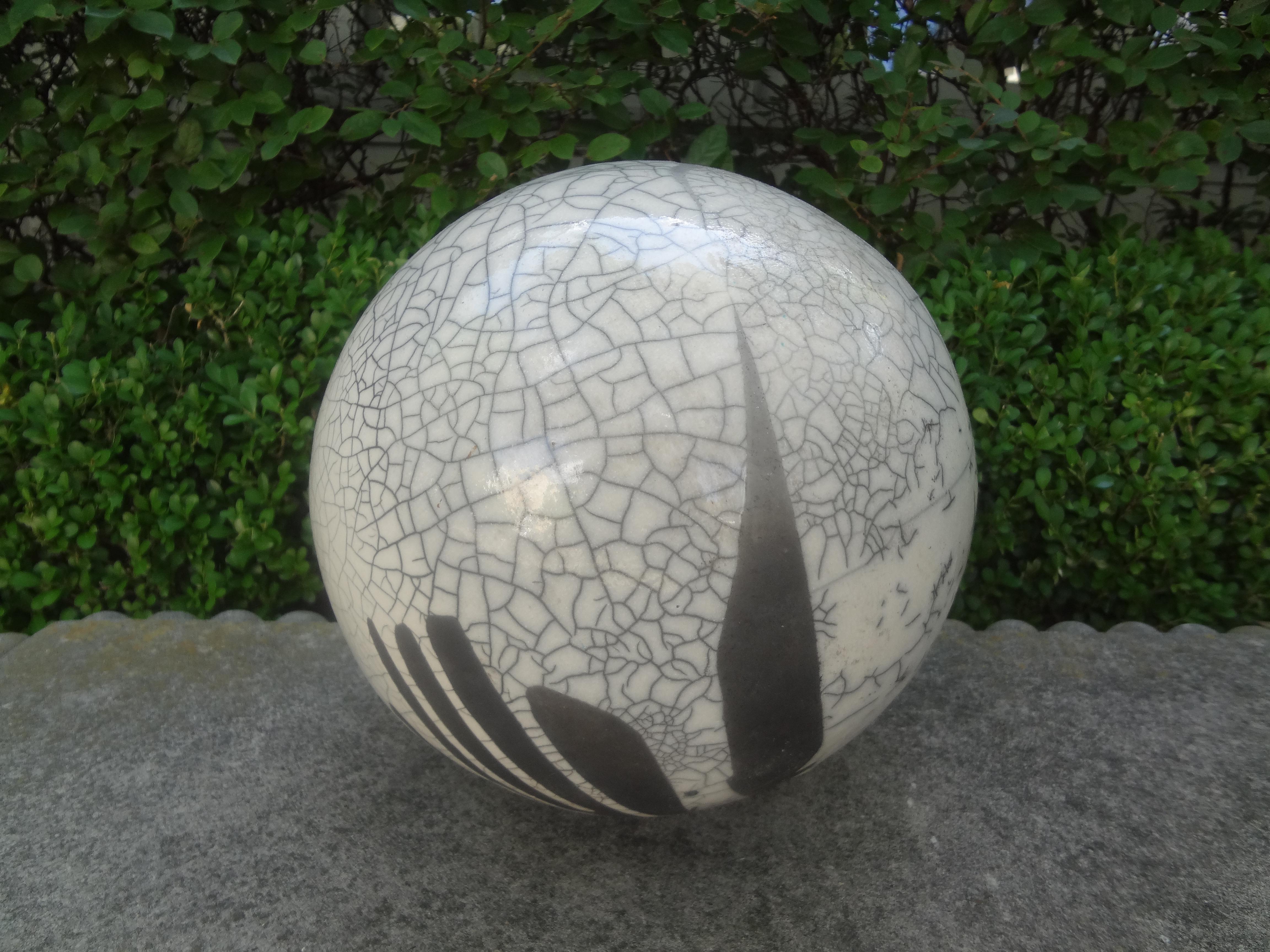 Large black and white abstract sphere sculpture attributed to Yuri Zatarain.
Interesting Mid-Century Modern hand decorated black and white abstract sphere sculpture attributed to Yuri Zatarain. This stunning vintage ceramic sphere sculpture is