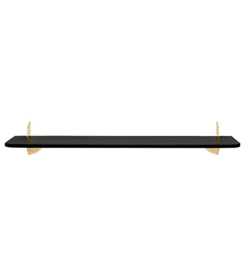 Large black ash and steel minimalist shelf 
Dimensions: L 80 x W 18 x H 12 cm 
Materials: Steel W. powder coating, brass plating & black ash MDF.
Also available in walnut MDF and size small. 

Simplicity always seems to make the most sense. The