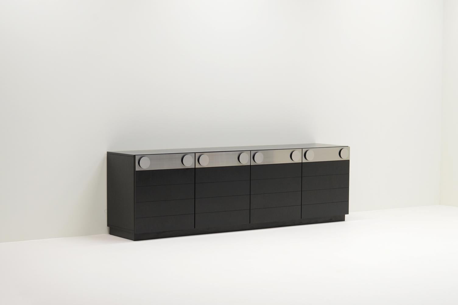 Large black Brutalist sideboard, Belgium 1970s. Shelving and drawers on the inside. The sideboard features a satin / matt black finish and brushed aluminum details. Some wear on the handles. In good vintage condition. 

  