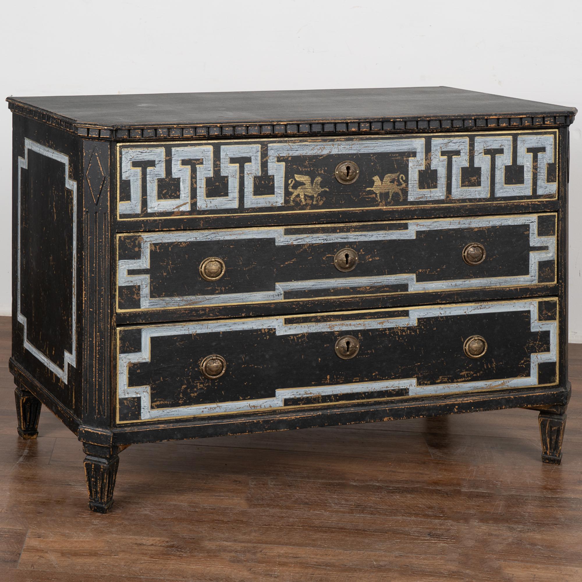 A large decorative Gustavian style pine chest of drawers with dramatic 