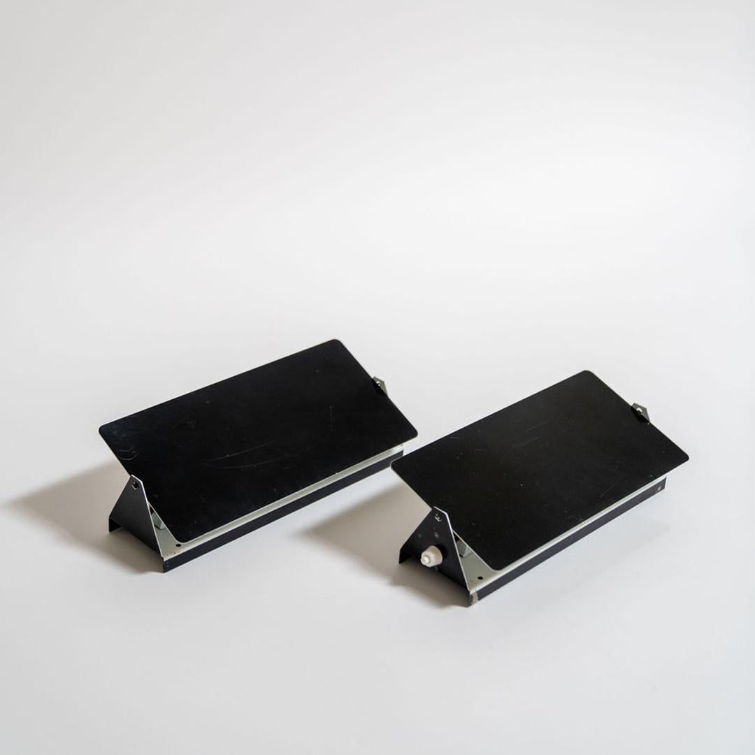 The iconic enameled wall lights by Charlotte Perriand from the 1960’s designed for the apartments of the ski resort Les Arcs in the French Alps. Its adjustable reflectors, can be mounted horizontally or vertically. Sold individually. 

*** each