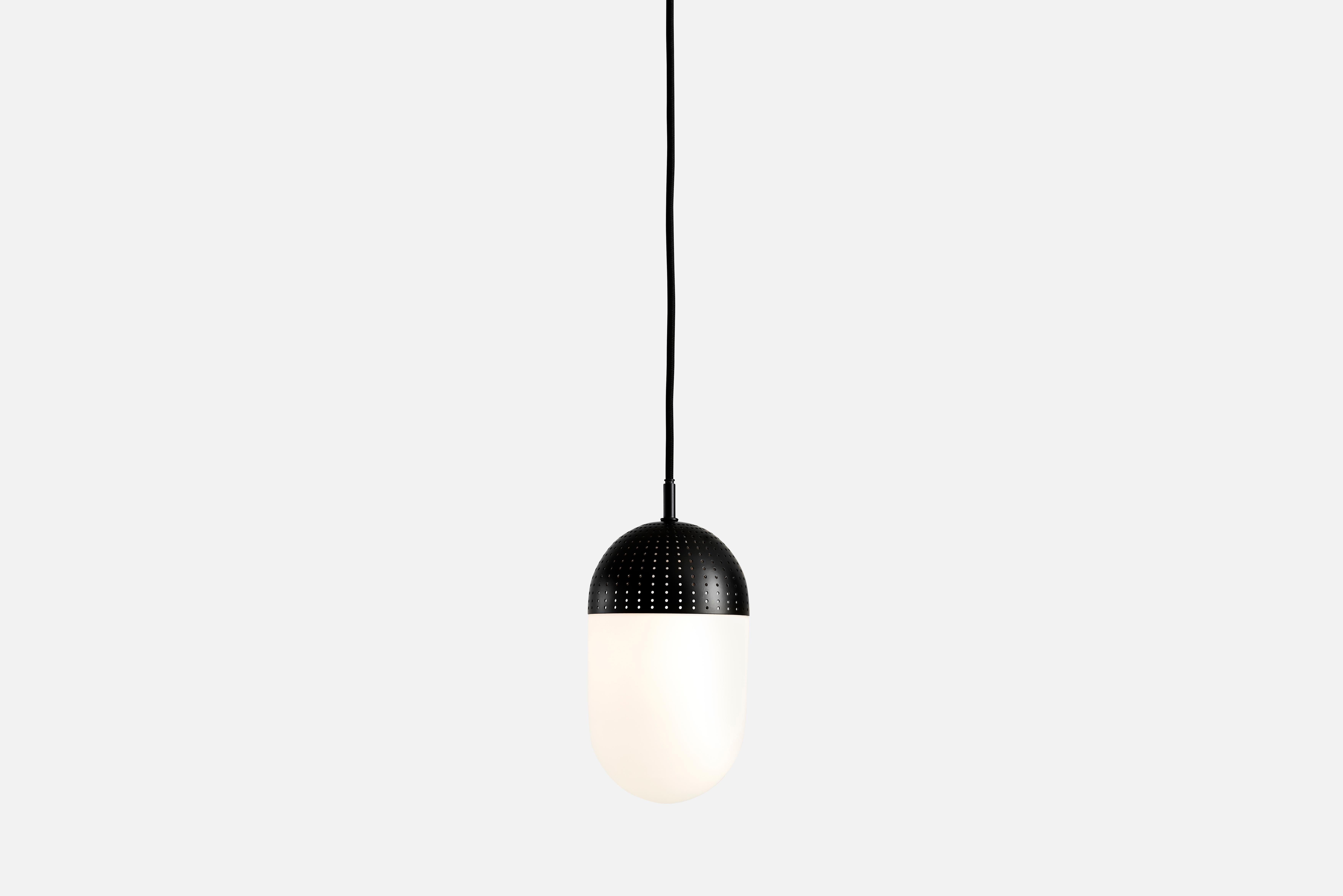 Large black dot pendant lamp by Rikke Frost
Materials: Metal, glass.
Dimensions: D 14 x H 21 cm
Available in black or satin and in 3 sizes: H 13, H 16.6, H 21 cm.

Rikke Frost is a Danish graduate from the School of Architecture Aarhus. Since