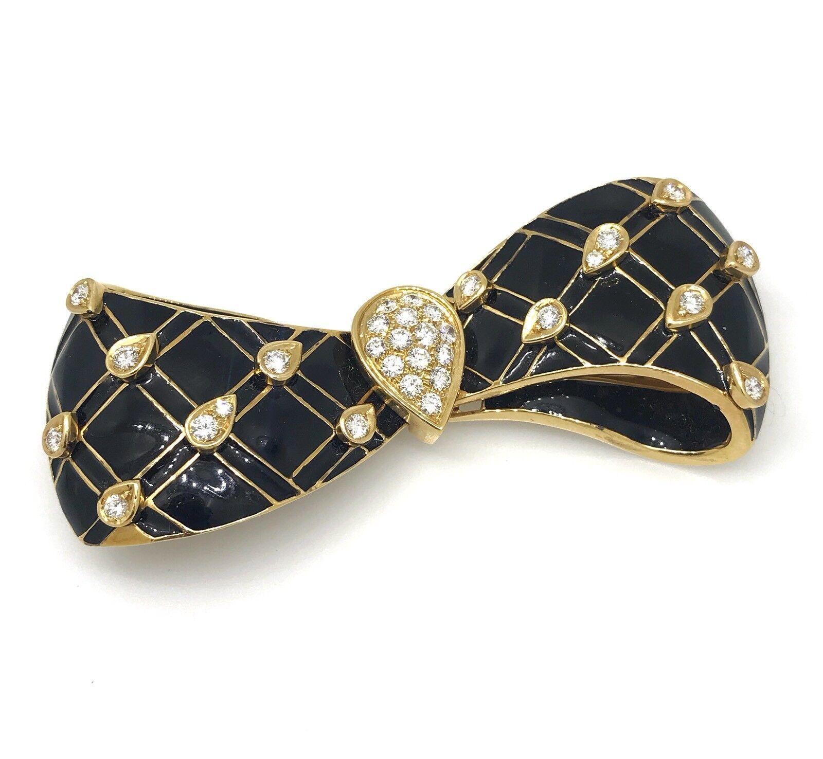 Estate Black Enamel and Diamond Bow Pin / Brooch in 18k Yellow Gold

Large Black Enamel Diamond Bow Brooch features a Pear shaped Pave Diamond section in the center and Diamond patterned on the background with black enamel all in 18k Yellow Gold.