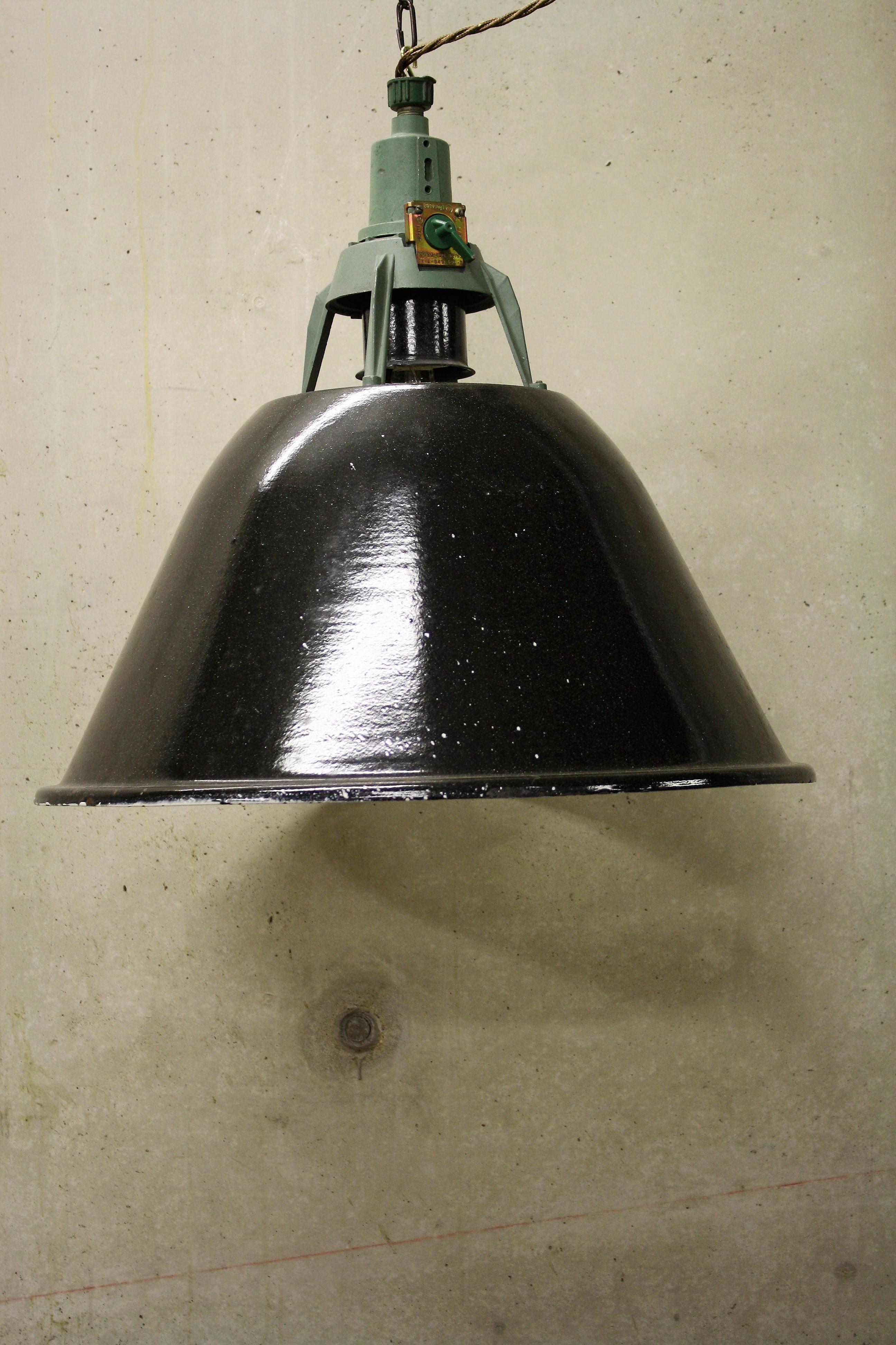 Large black enamel pendant lights salvaged from an old factory in Russia.

These lamps are in a beautiful used condition and have cast iron tops.

The industrial lamps look stunning in a bar, restaurant, shop or in your living room.

These are