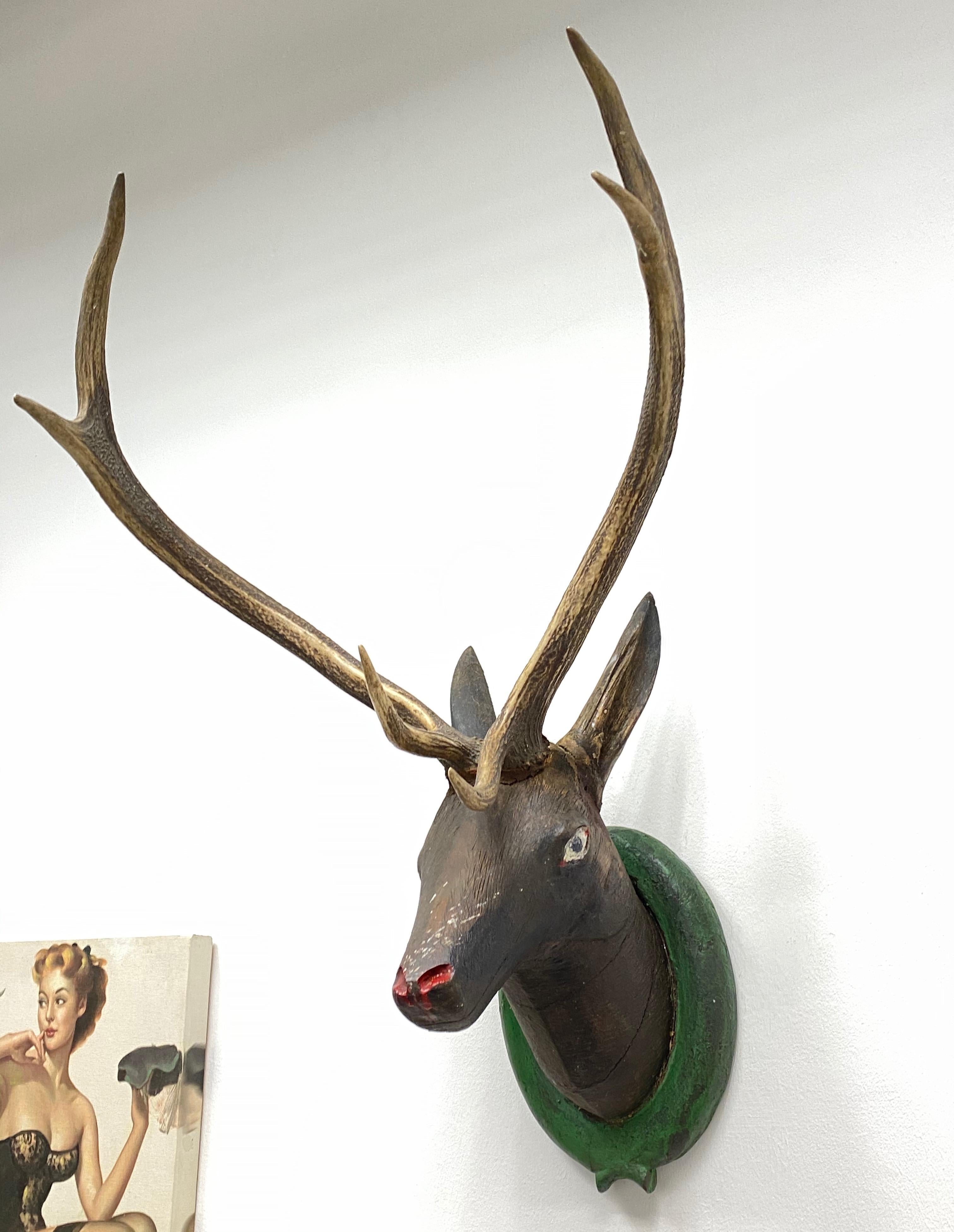 A great looking hand carved original wooden Folk Art deer head wall decoration. A great piece for a suitable ambiance in a trophy room or the office of a Hunter or Woodsman. More than likely one of the Folk Art items made between 1860 and the late
