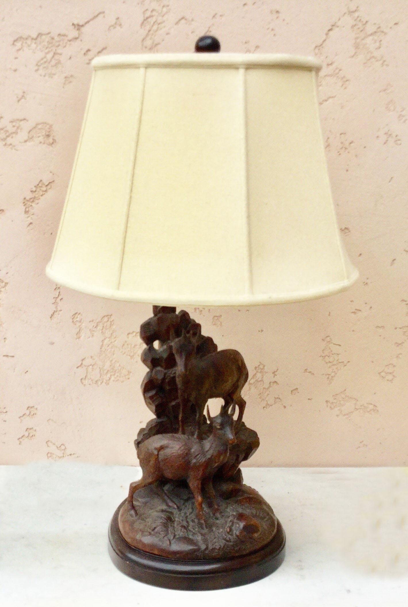 Large black forest lamp with two mountain goats on a rack, circa 1880.
Electrified and wired for US, include shade.