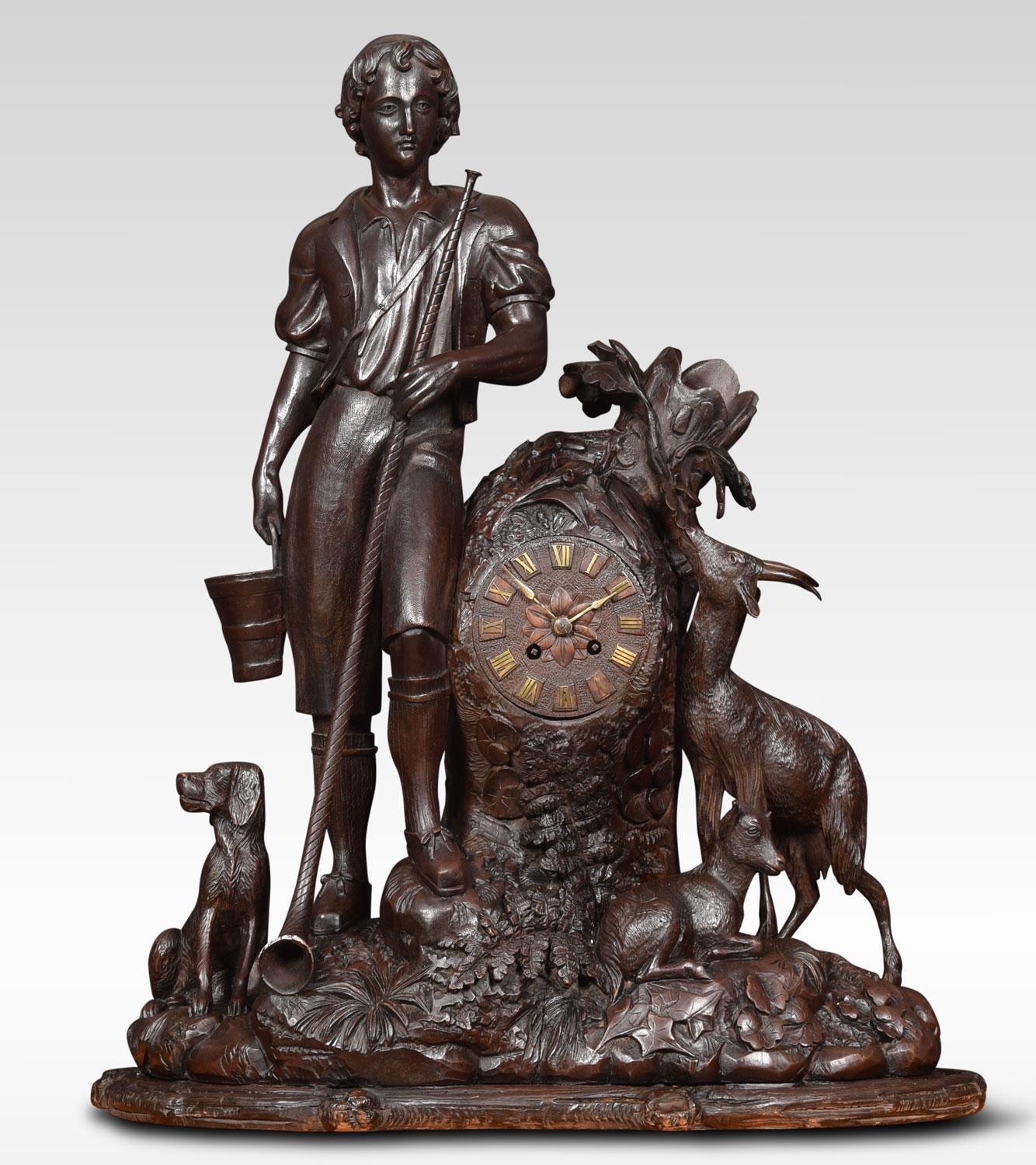 19th century black forest mantel clock, with carved wood dial to the French eight day two train movement striking on a bell. The case with goat-herd and his dog, with an ibex on mountainside.
Dimensions:
Height 27 inches
Width 23 inches
Depth 10