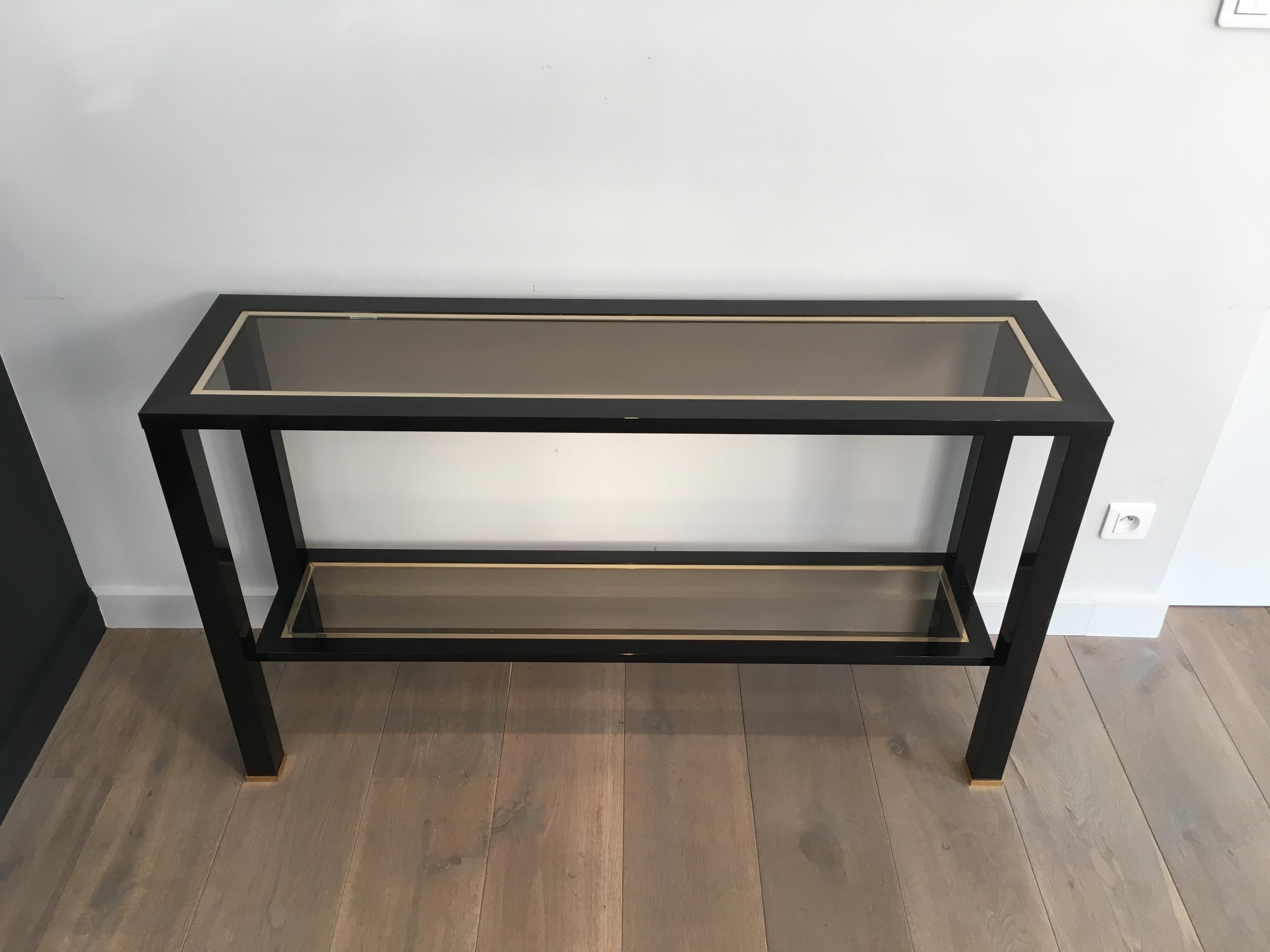 Large black lacquered and brass console table. French, circa 1970.
 