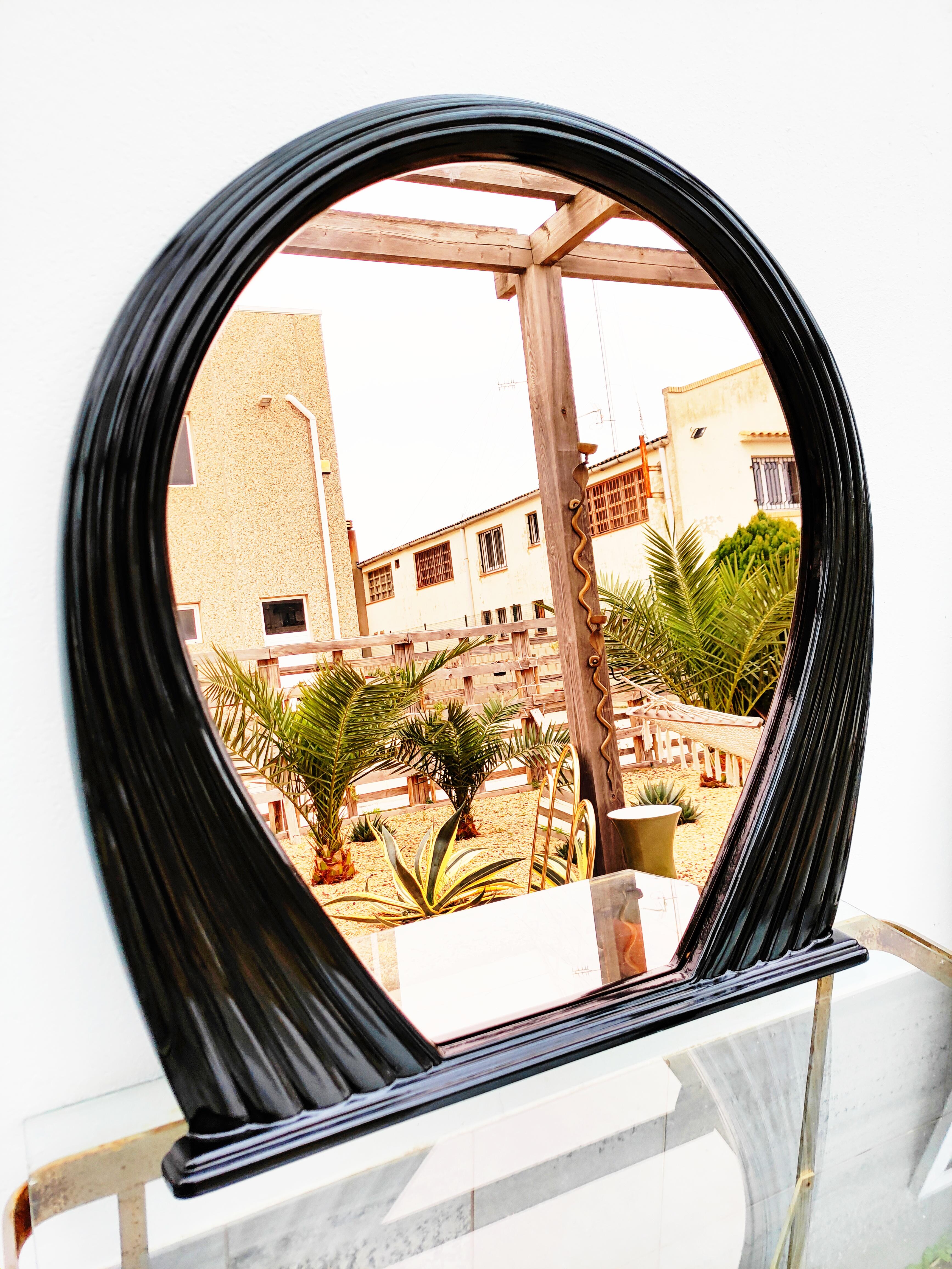 Beautiful and rare large black lacquered mirror, manufactured in France in 1970s. The mirror is slightly smoked coppery.
Dimensions: (cm) 80 W x 90 H x 8 D.