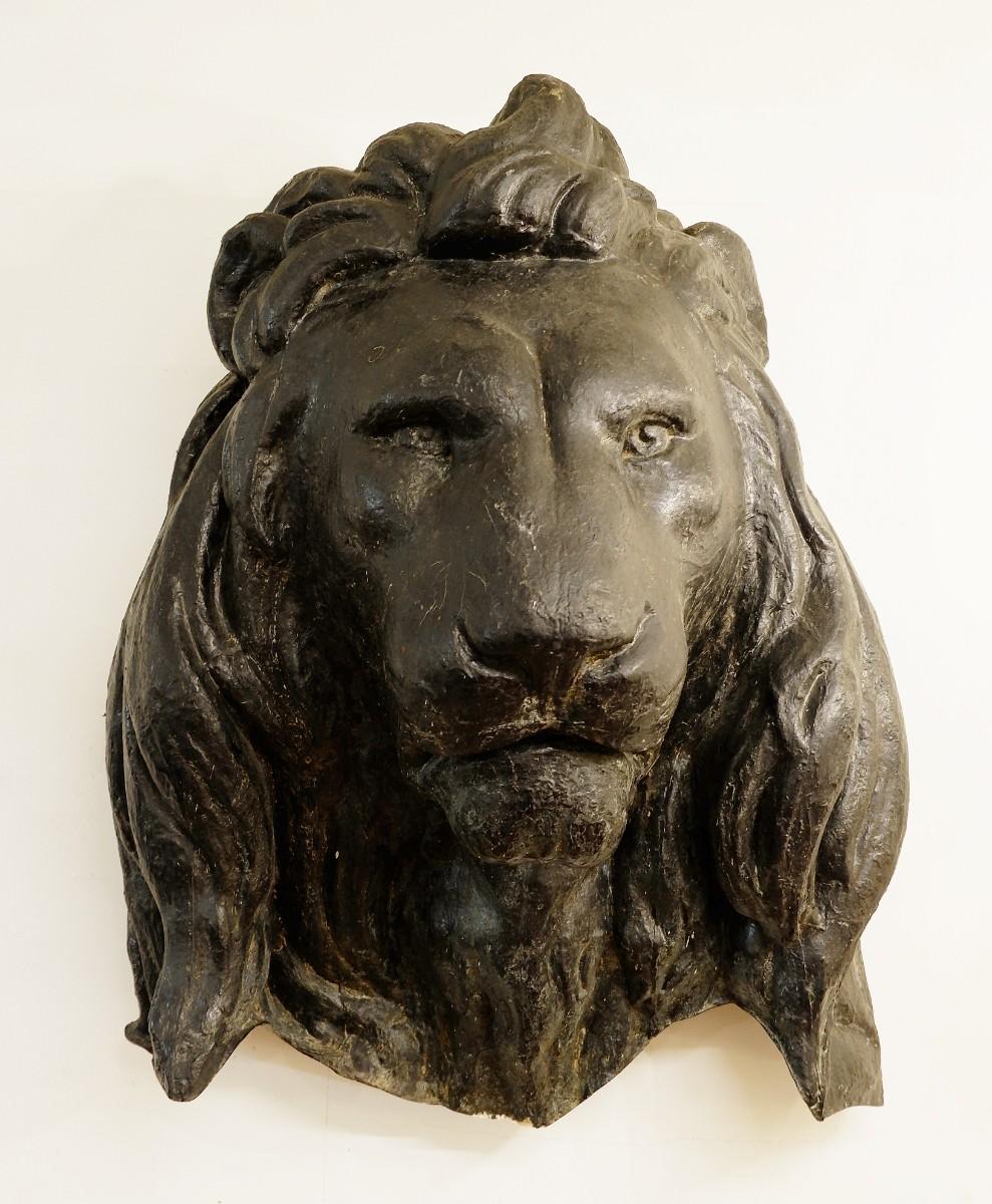 Large black lion head in fiberglass.
