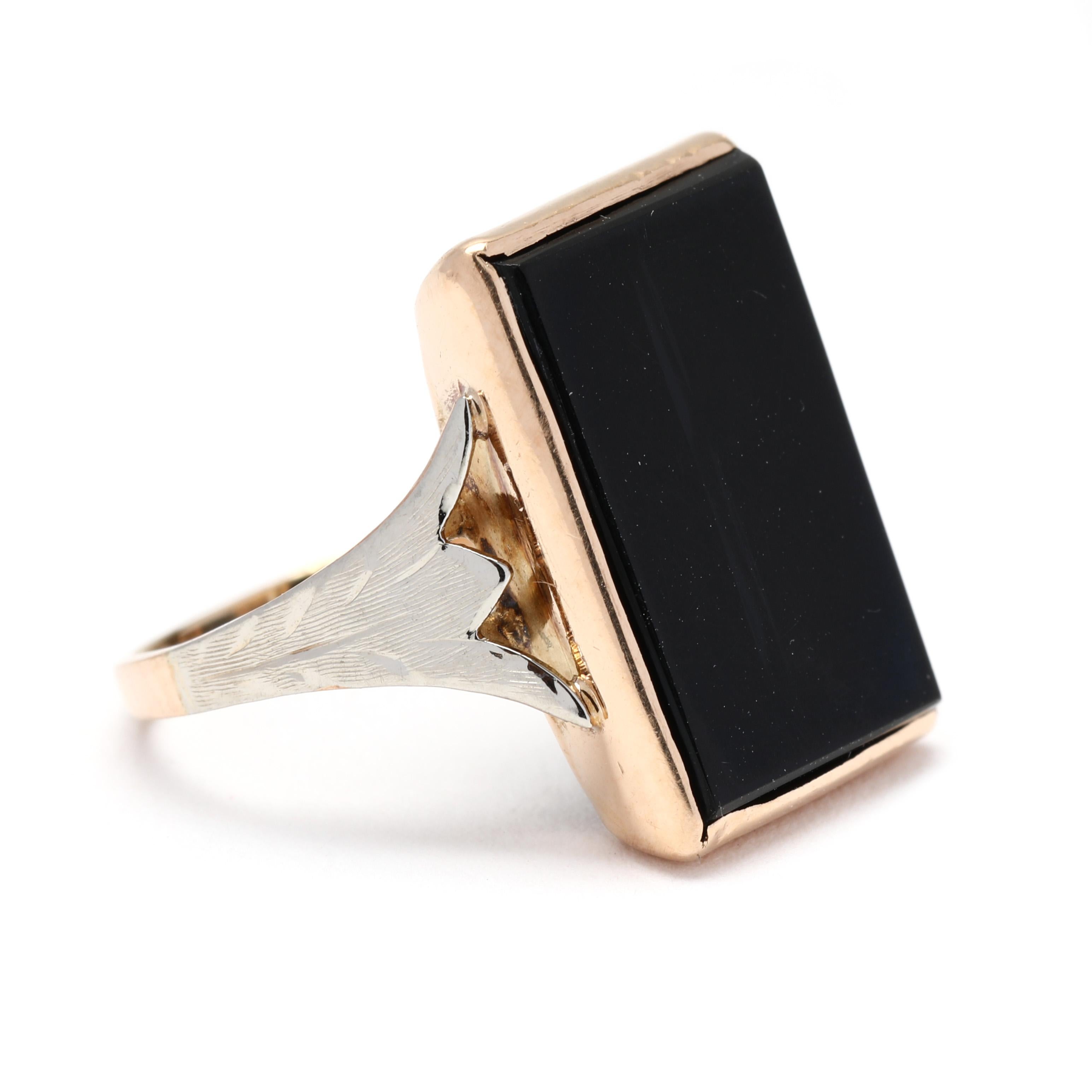 This eye-catching ring features a large, rectangular black onyx gemstone set in a 10k yellow gold setting. The black onyx, known for its deep, rich color, is beautifully contrasted by the warm tone of the gold. The rectangular shape of the gemstone
