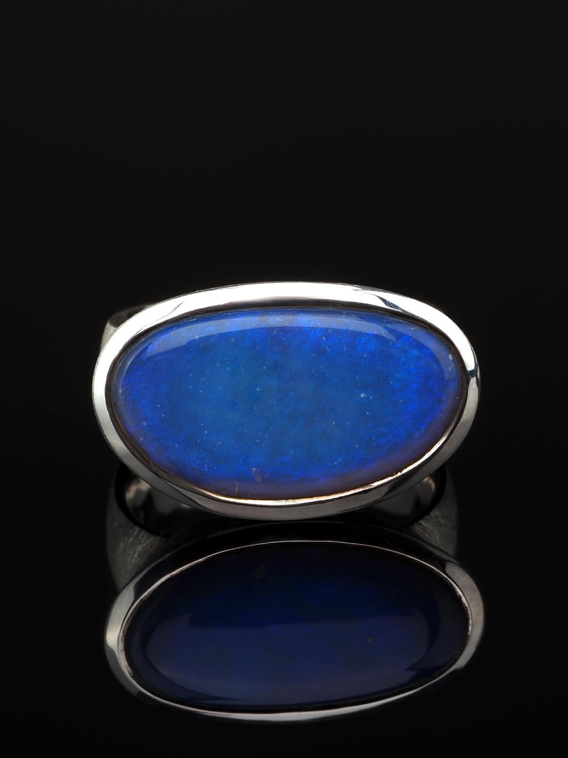Large matte finish silver ring with natural Black Opal 
gemstone origin - Australia
opal measurements - 0.12 x 0.51 x 0.91 in / 3 x 13 x 23 mm
opal weight - 8.55 carats
ring size - 8.5 US
ring weight - 12.31 grams


We ship our jewelry worldwide –