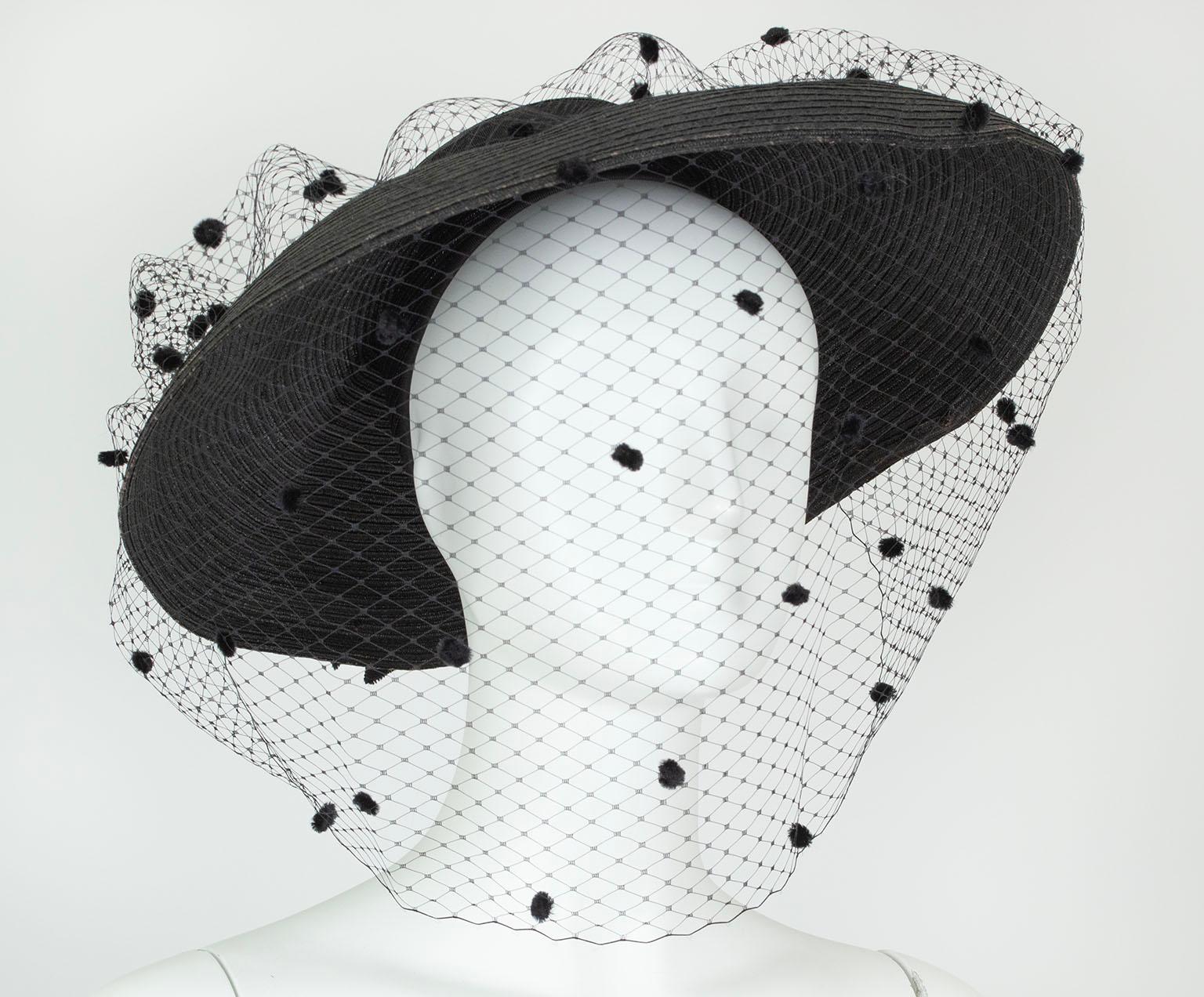 Appropriate for a multitude of occasions from mourning to tea to church to cocktails, this magnificent cartwheel hat gushes both propriety and drama thanks to its foot-long chenille dot veil. An integrated interior cap keeps it securely perched on