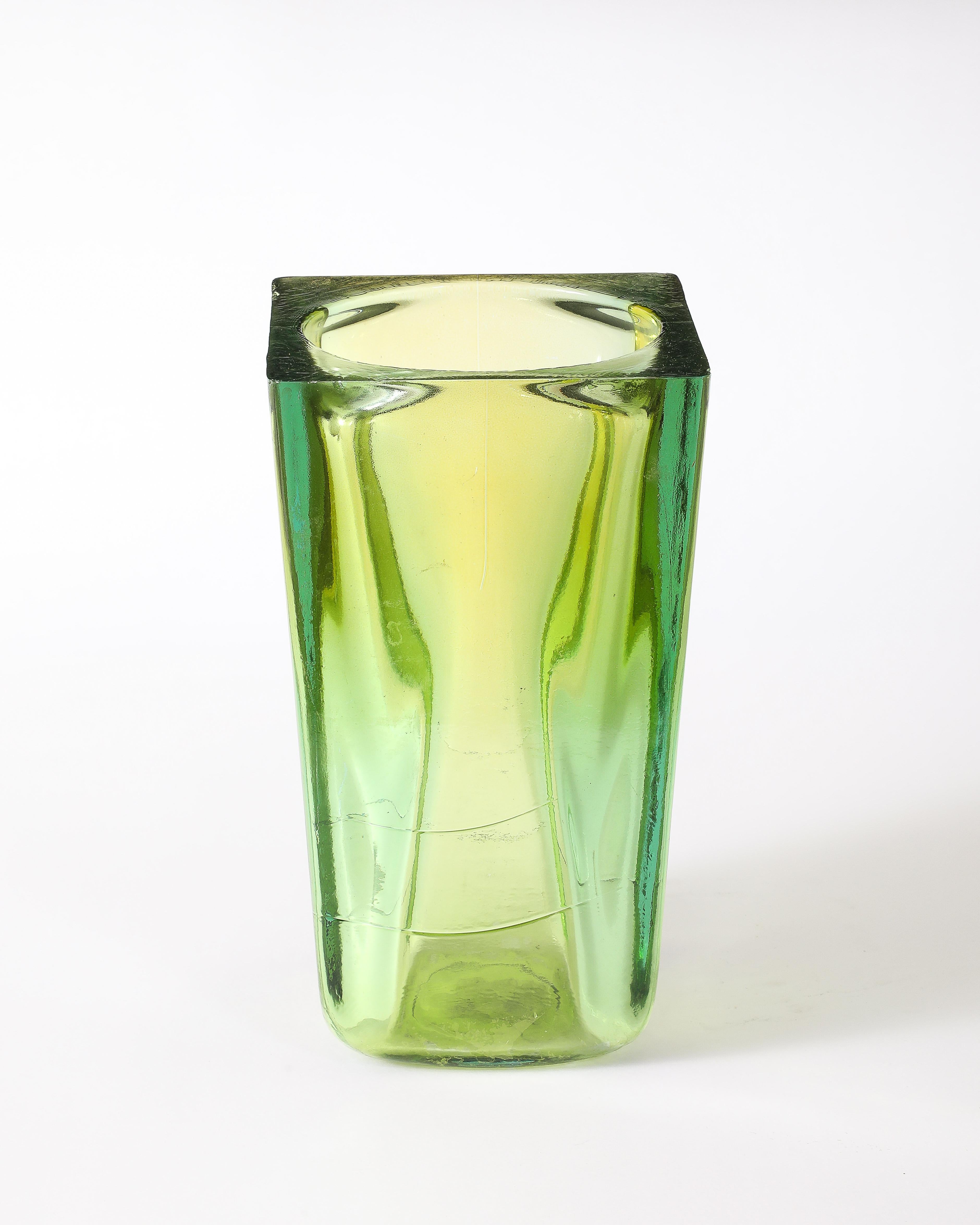 Solid cast glass vase by Blenko in green yellow hues.
