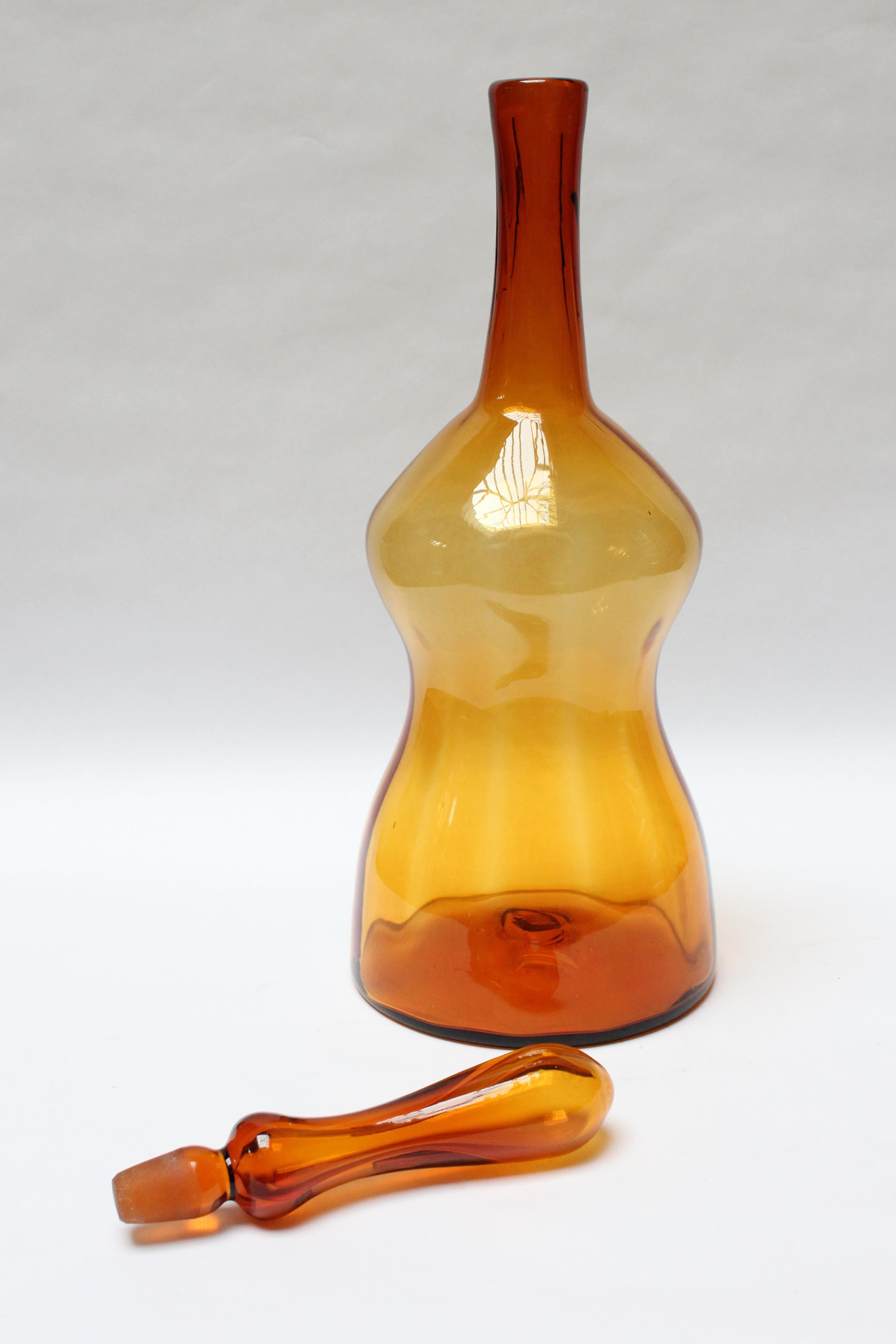 Blenko blown glass bottle designed in the 1960s by Joel Myers retaining its original stopper (appears in the 1969 catalog as model 6954). Sculptural form and impressive size in Blenko's 