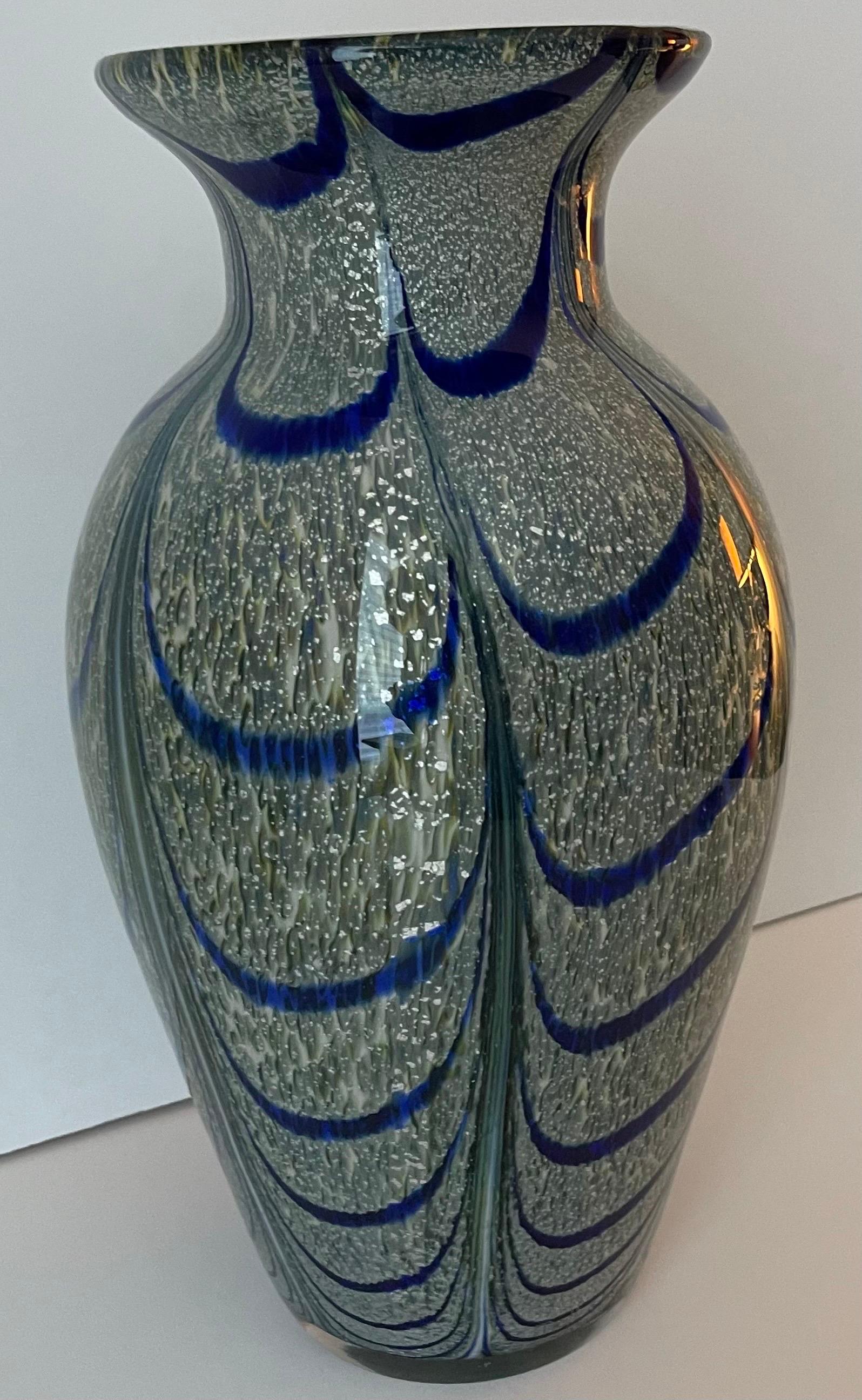 Large and substantial blown glass art vase. All over peacock swirl pattern with gold flecking throughout. No makers mark or signature.